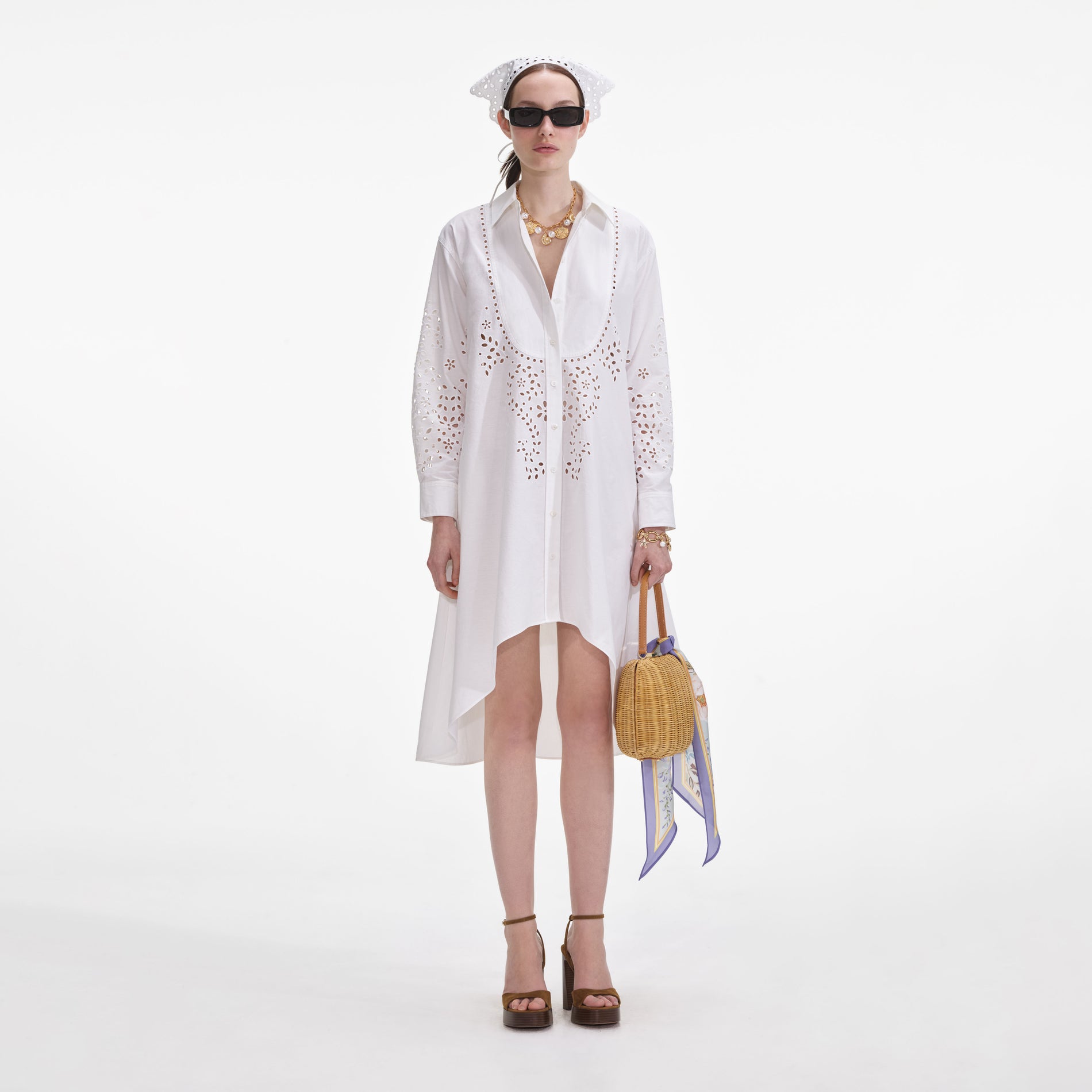 Front view of a woman wearing the White Cotton Embroidered Shirt Dress
