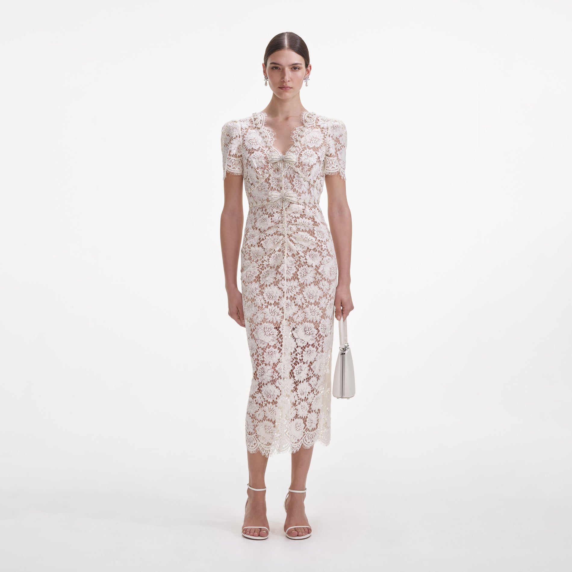 Front view of a woman wearing the Cream Fine Lace Pearl Midi Dress