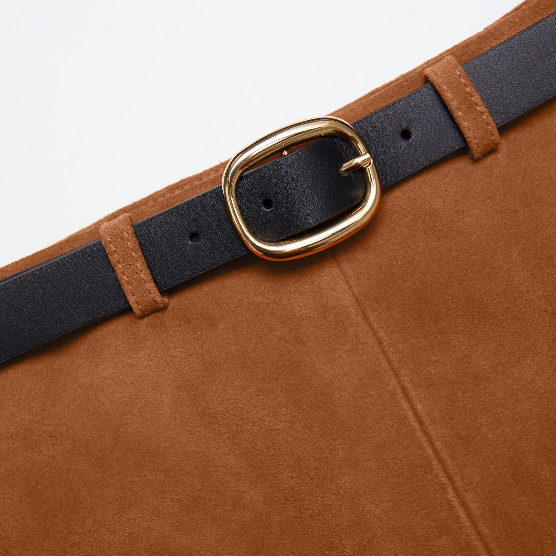 Side view of a woman wearing the Brown Suede Shorts