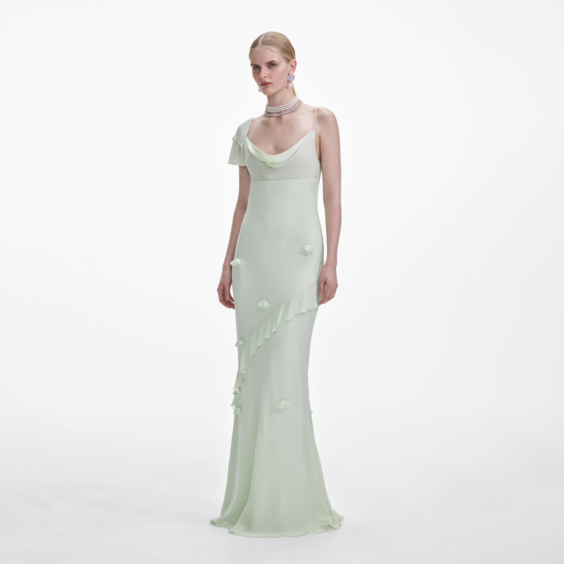 Side view of a woman wearing the Mint Georgette Flower Maxi Dress