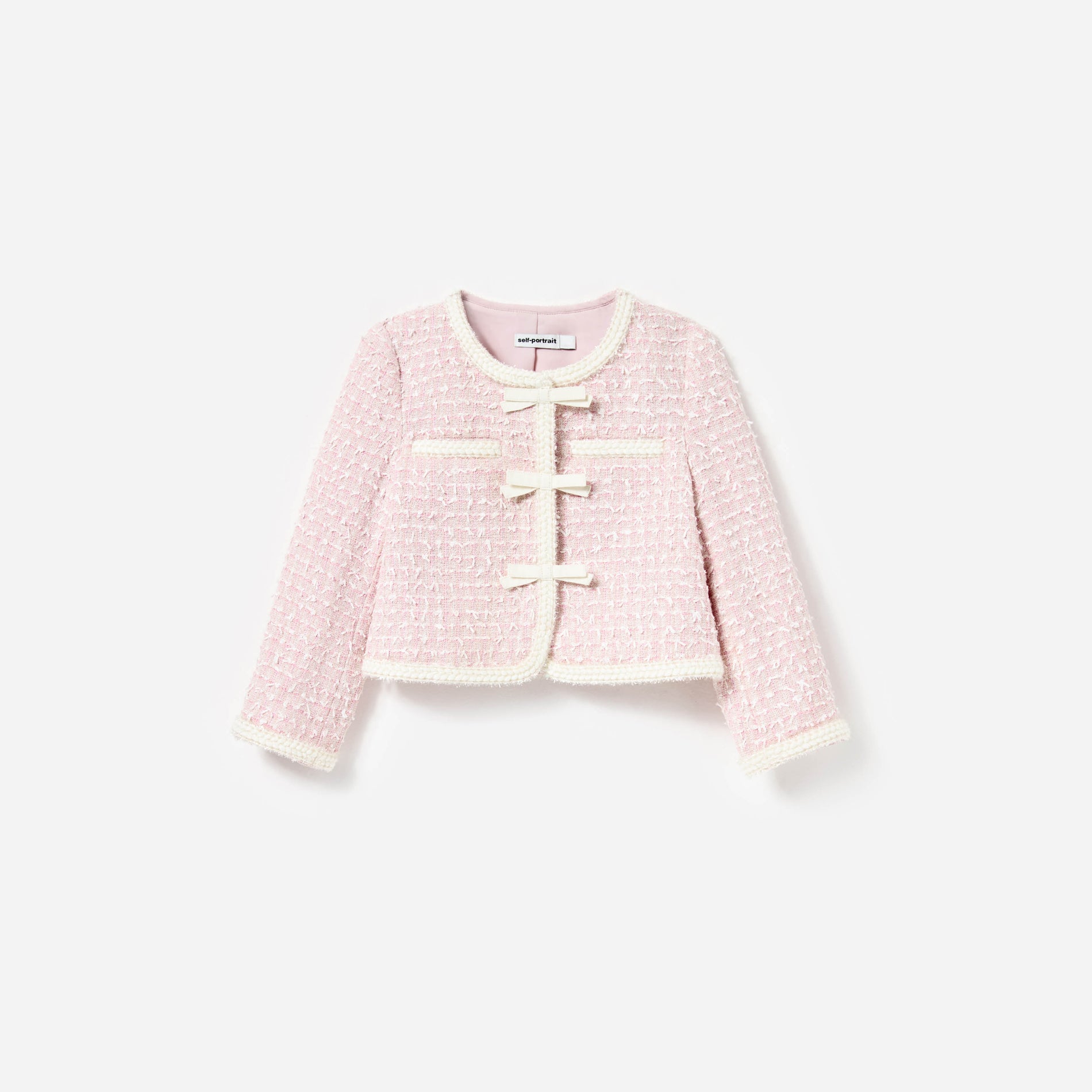 Front view of a woman wearing the Pink Bow Boucle Jacket