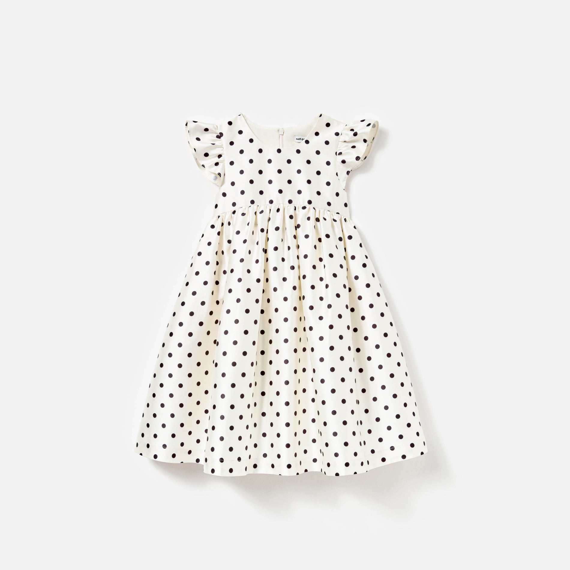 Front view of a woman wearing the Cream Polka Dot Taffeta Dress
