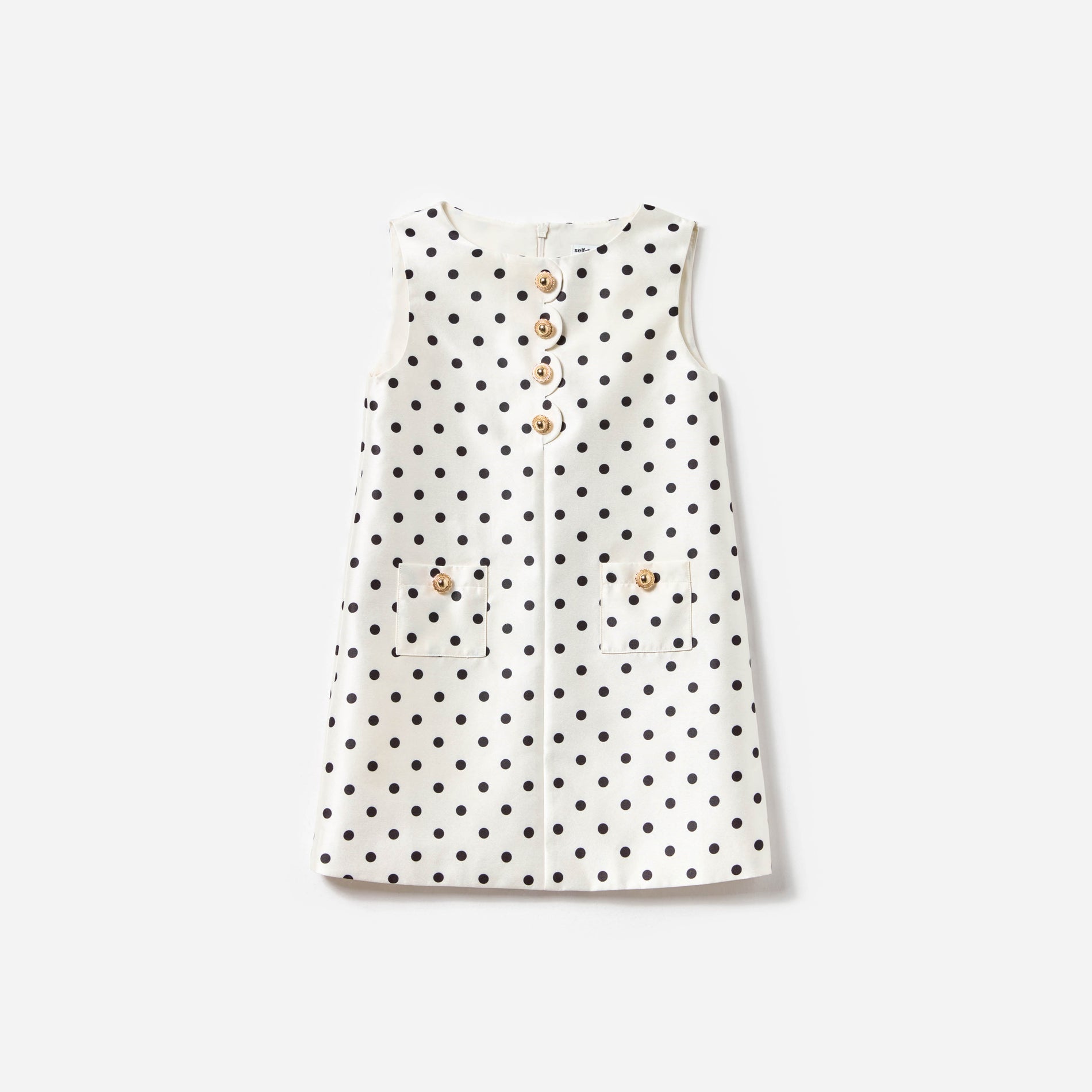 Front view of a woman wearing the Cream Sleeveless Polka Dot Taffeta Dress