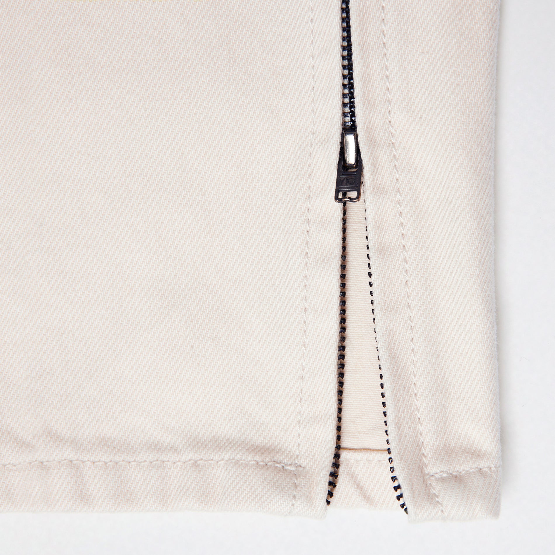 Side view of a woman wearing the Cream Denim Jeans