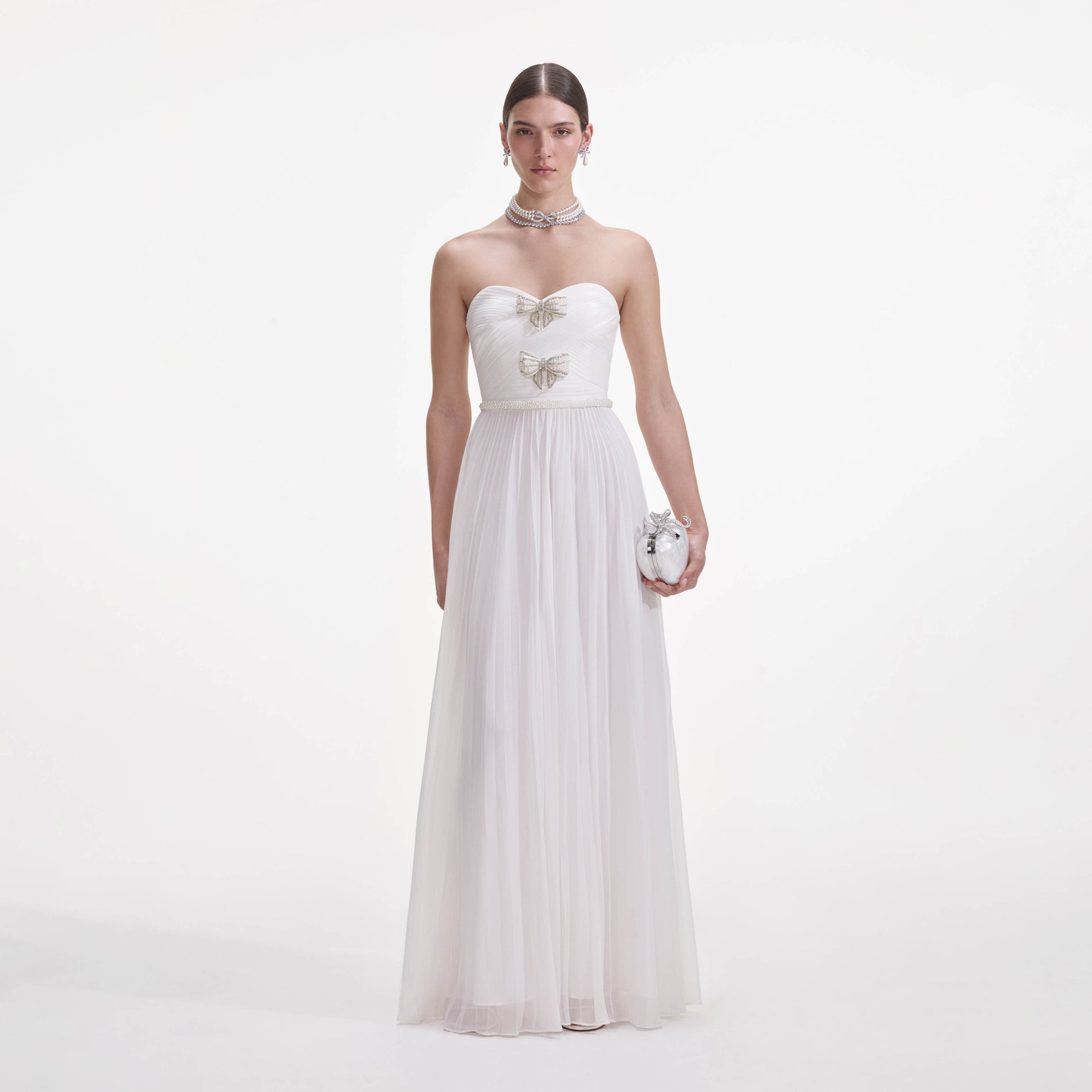 Front view of a woman wearing the White Chiffon Bow Maxi Dress