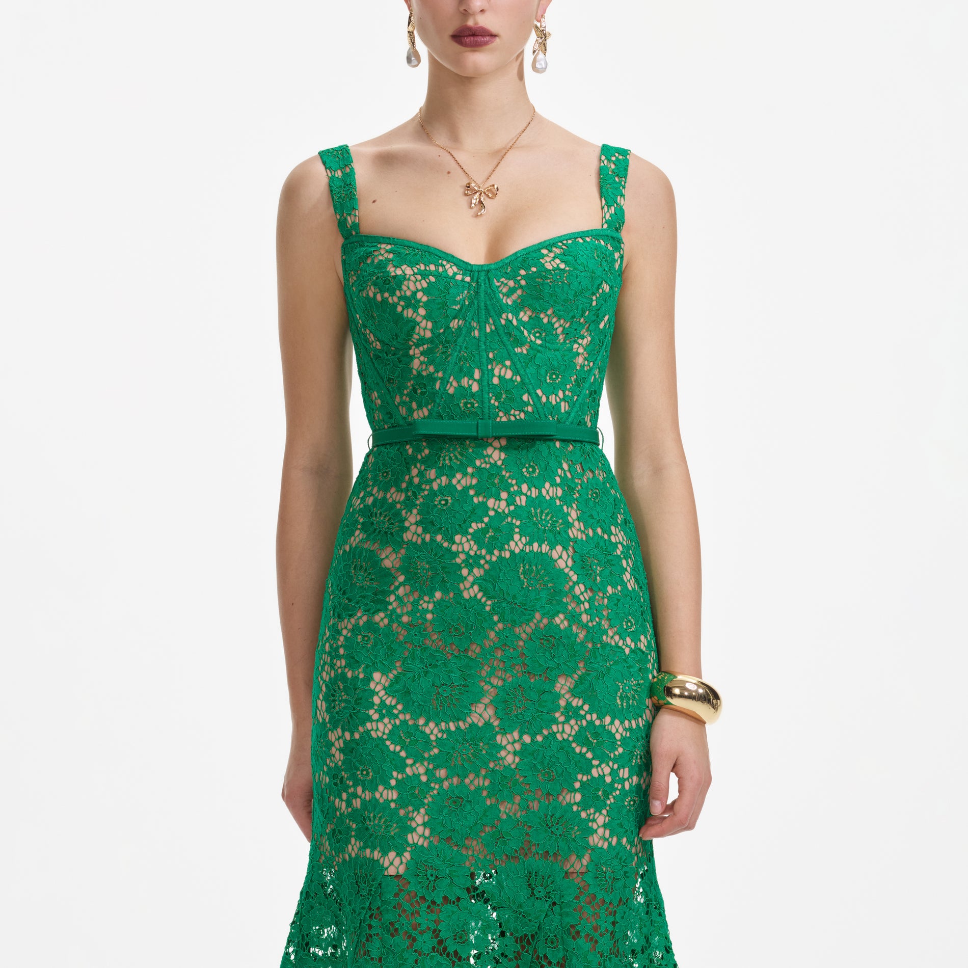 A close up of a woman wearing the Green Fine Lace Midi Dress