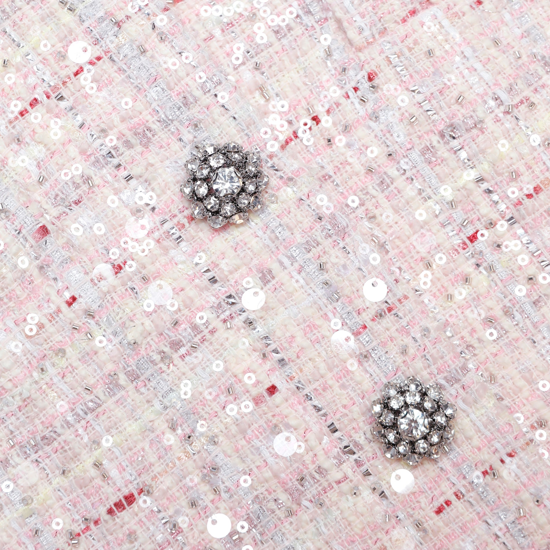 A close up of the fabric for the Pink Sequin Boucle Jacket