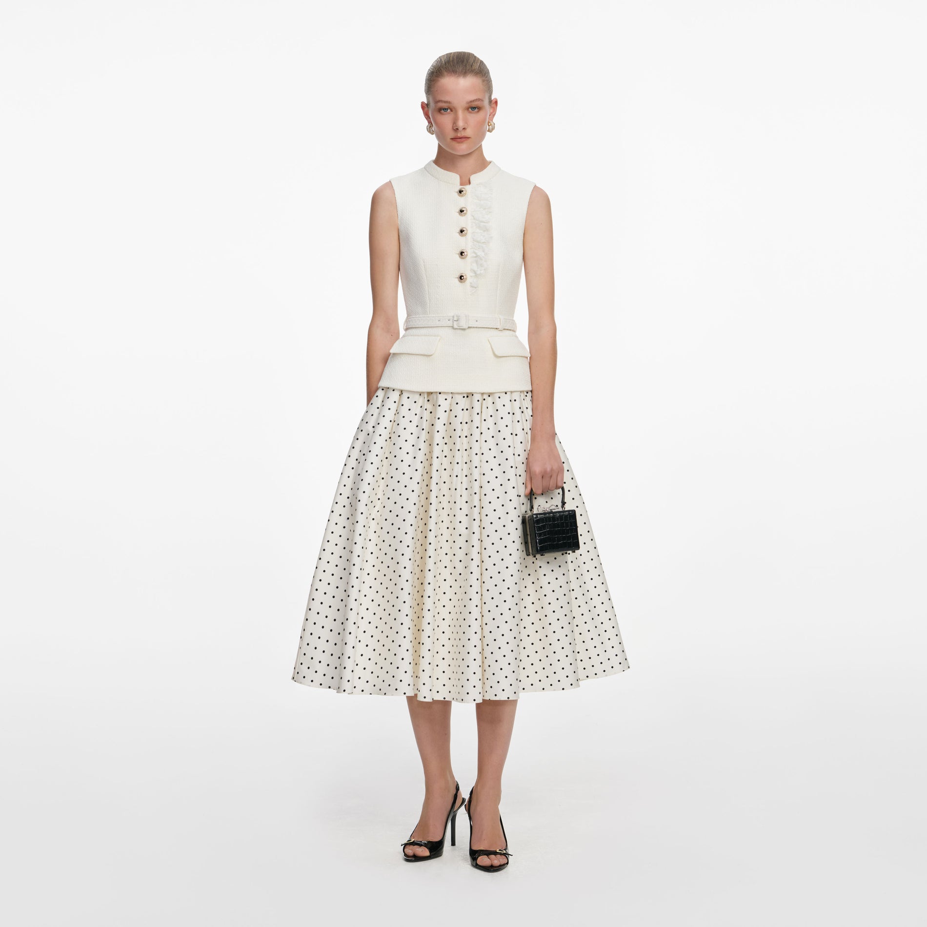 Front view of a woman wearing the Cream Boucle Polka Dot Midi Dress