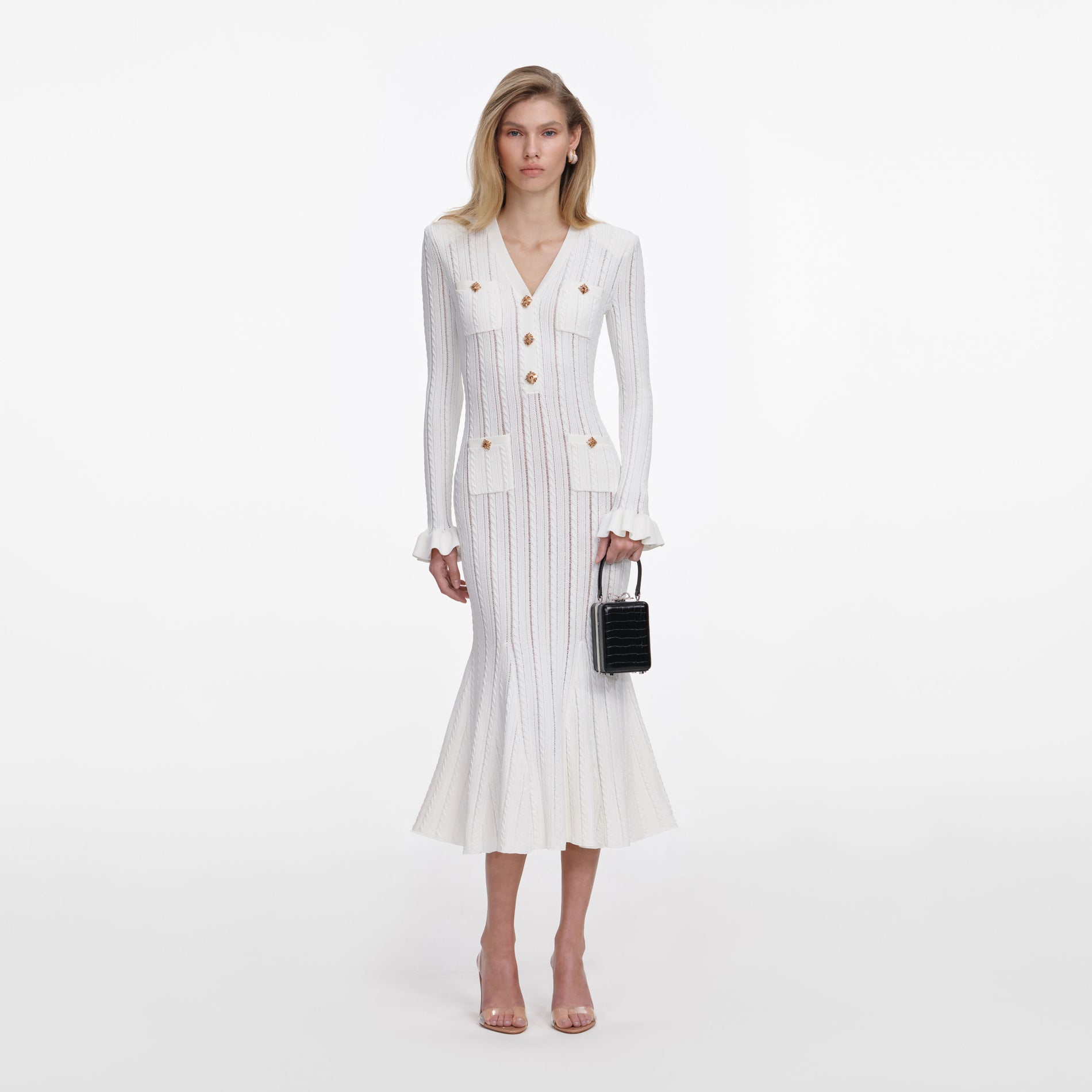 Front view of a woman wearing the White Pointelle Knit Midi Dress