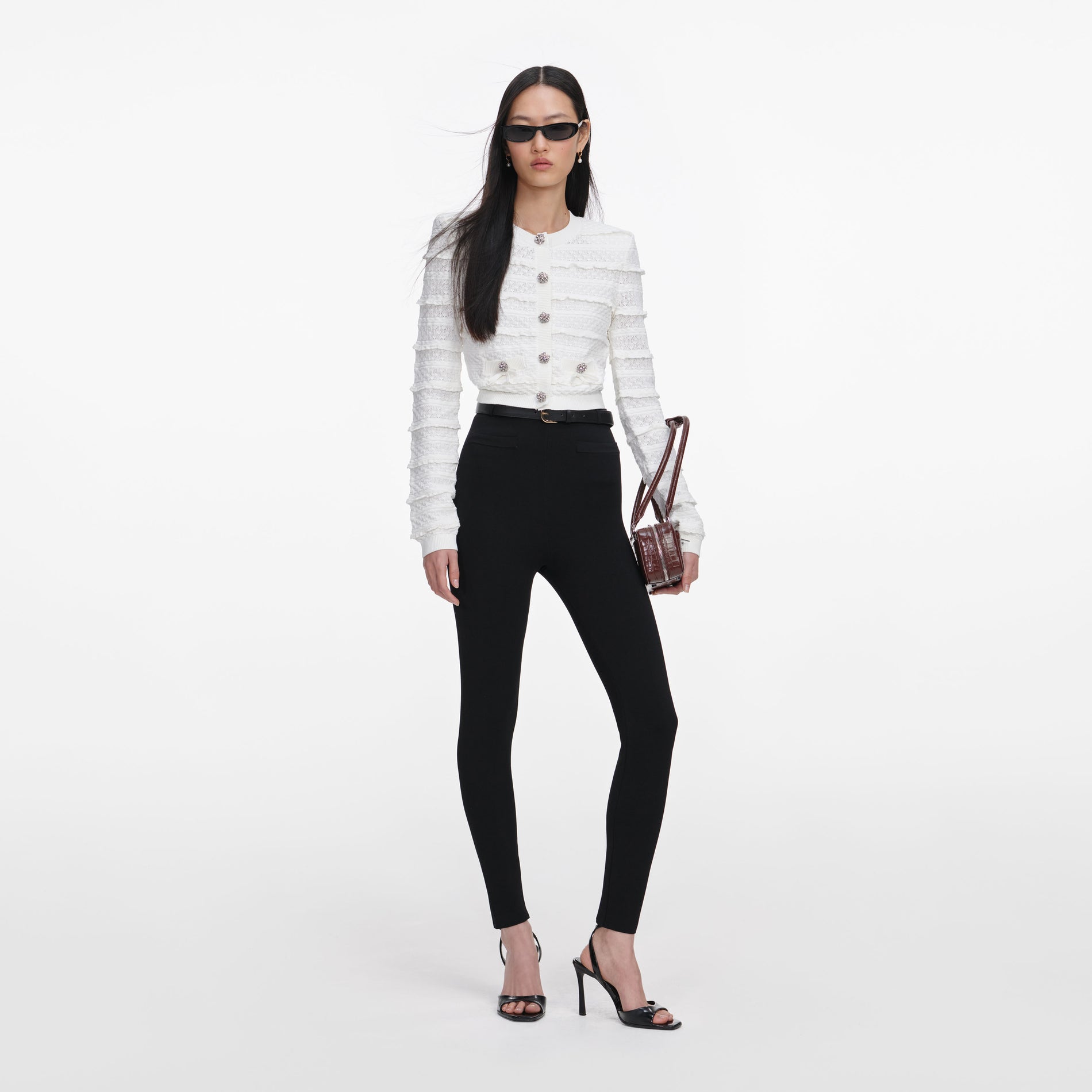 Front view of a woman wearing the White Pointelle Diamante Cardigan