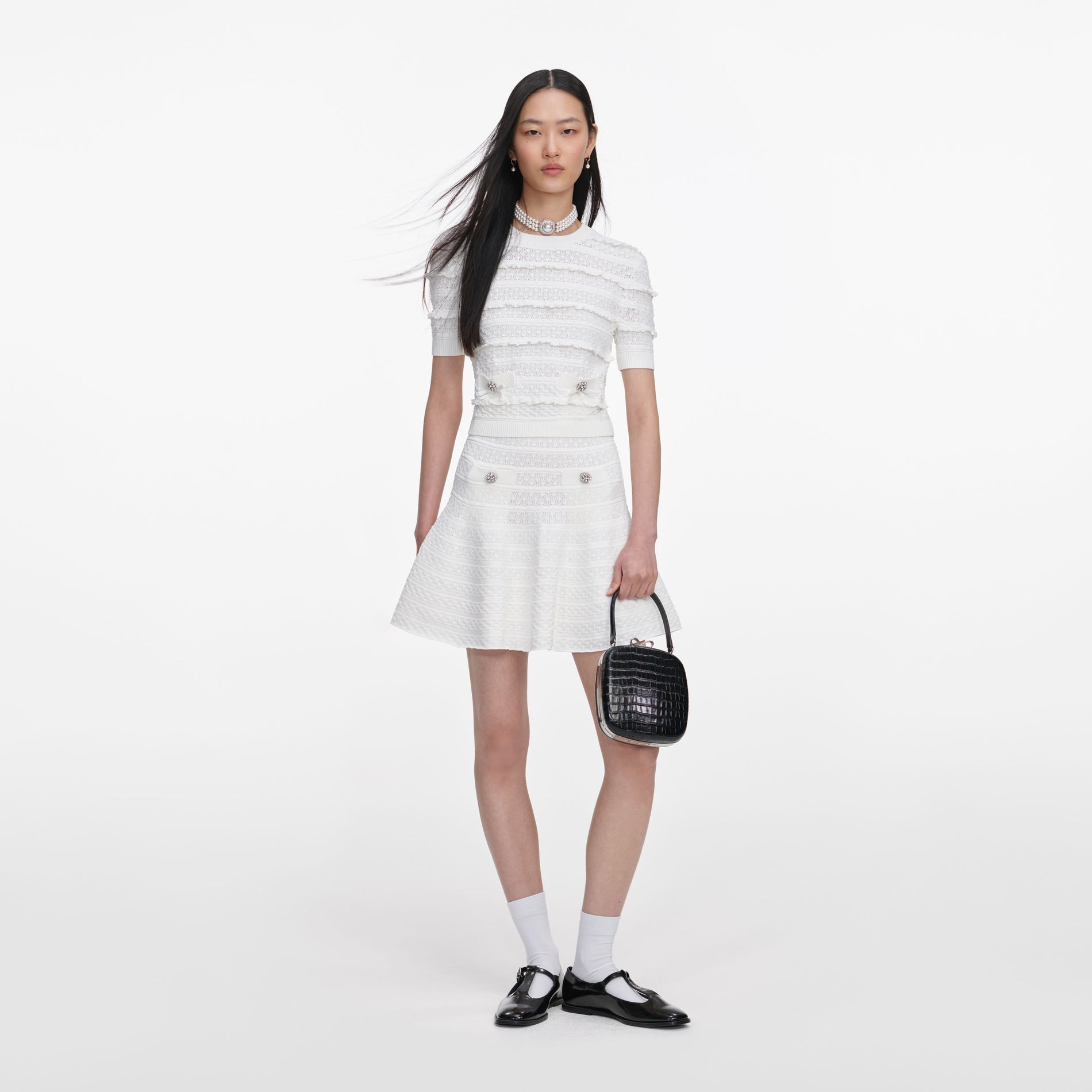 Front view of a woman wearing the White Pointelle Knit Top