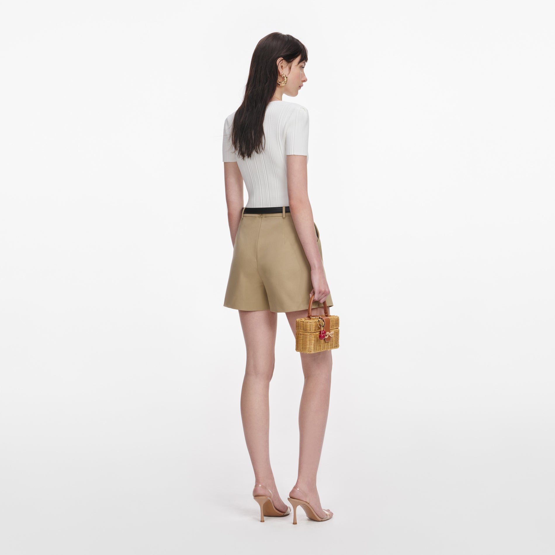 Back view of a woman wearing the Beige Cotton Skort