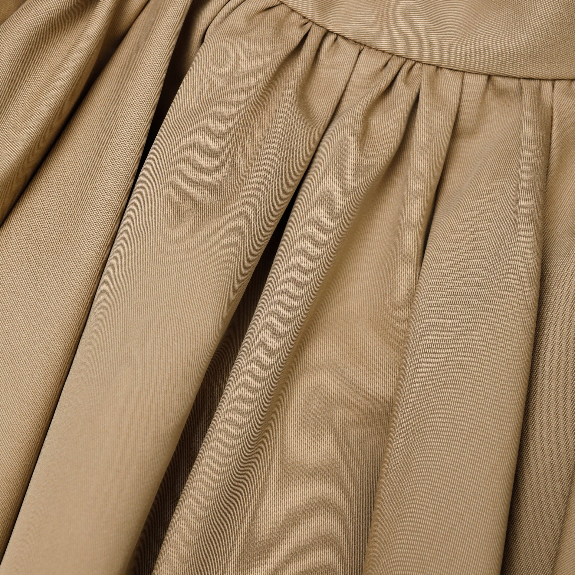 A close up of the fabric for the Tan Cotton Mini Skirt