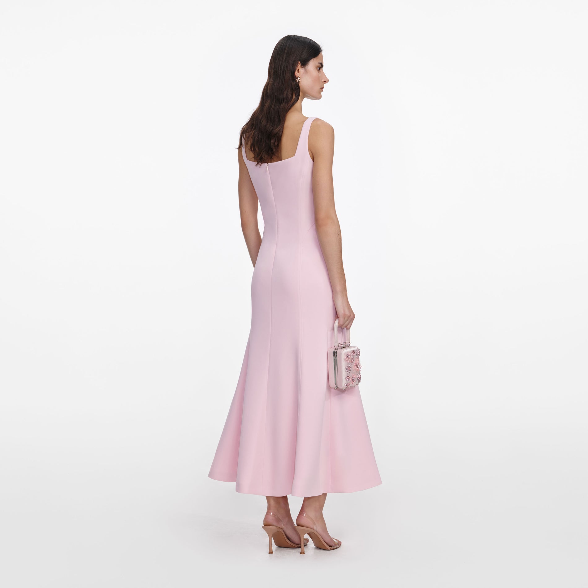 Back view of a woman wearing the Pink Crepe Midi Dress