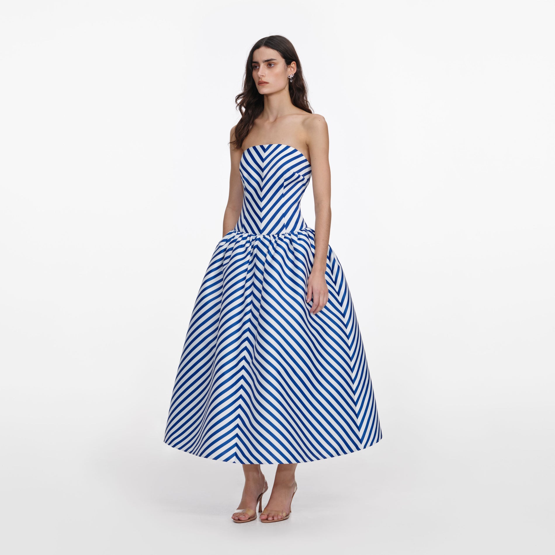 Side view of a woman wearing the Navy Stripe Taffeta Midi Dress