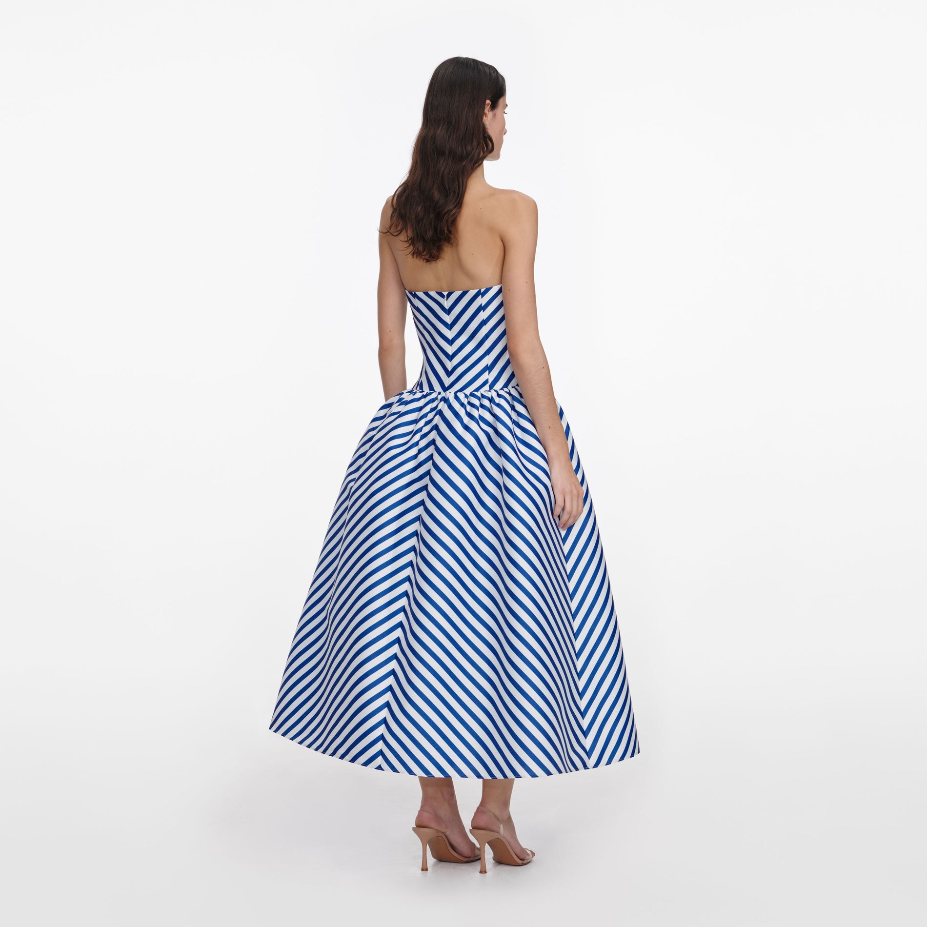 Back view of a woman wearing the Navy Stripe Taffeta Midi Dress