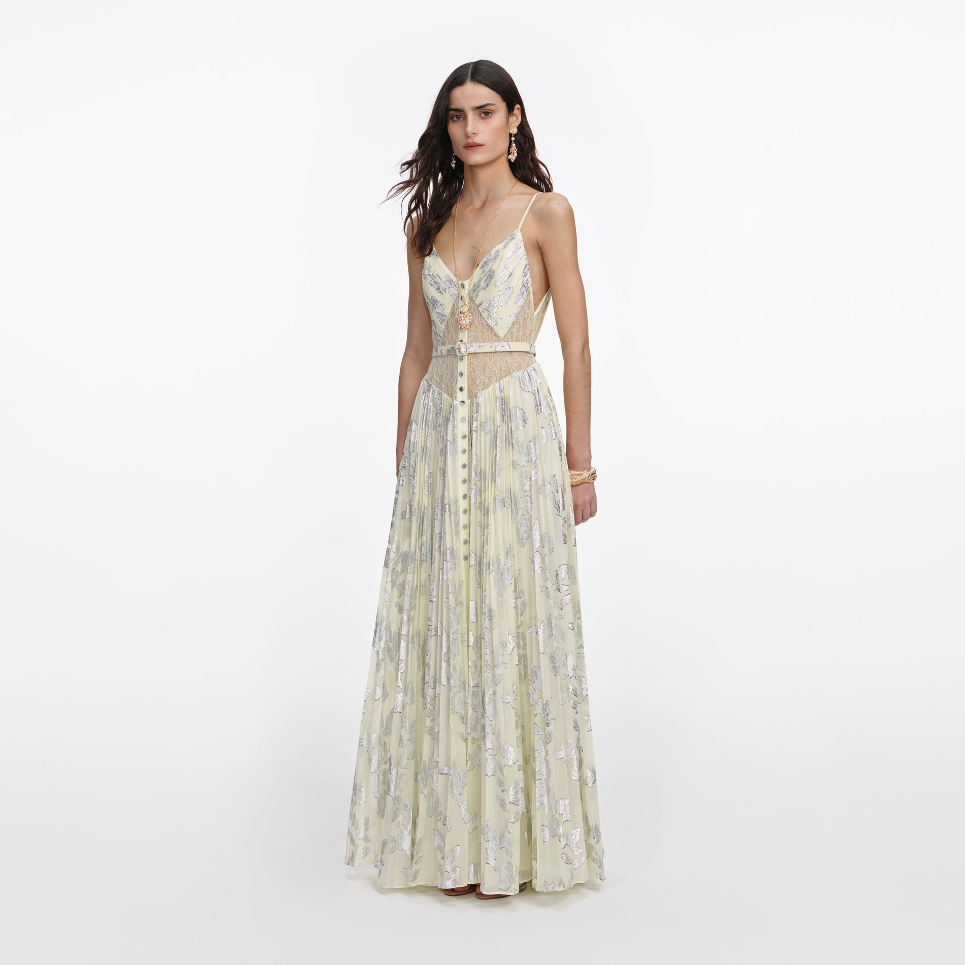 Side view of a woman wearing the Yellow Metallic Chiffon Maxi Dress