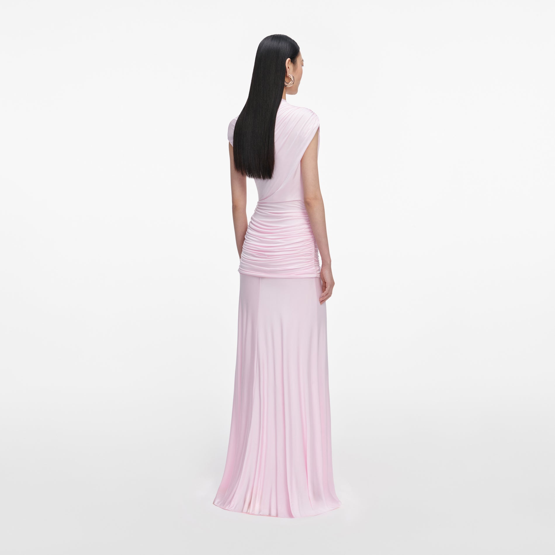 Back view of a woman wearing the Pink Jersey Draped Maxi Dress
