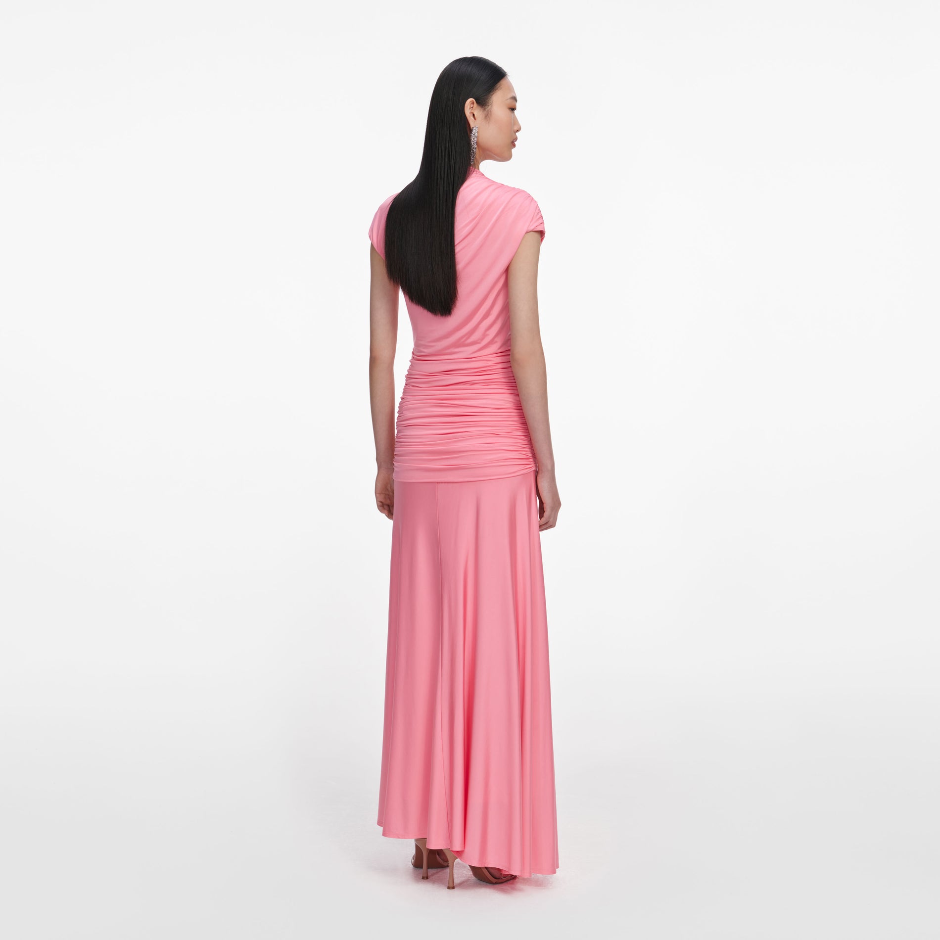 Back view of a woman wearing the Pink Jersey Gathered Maxi Skirt