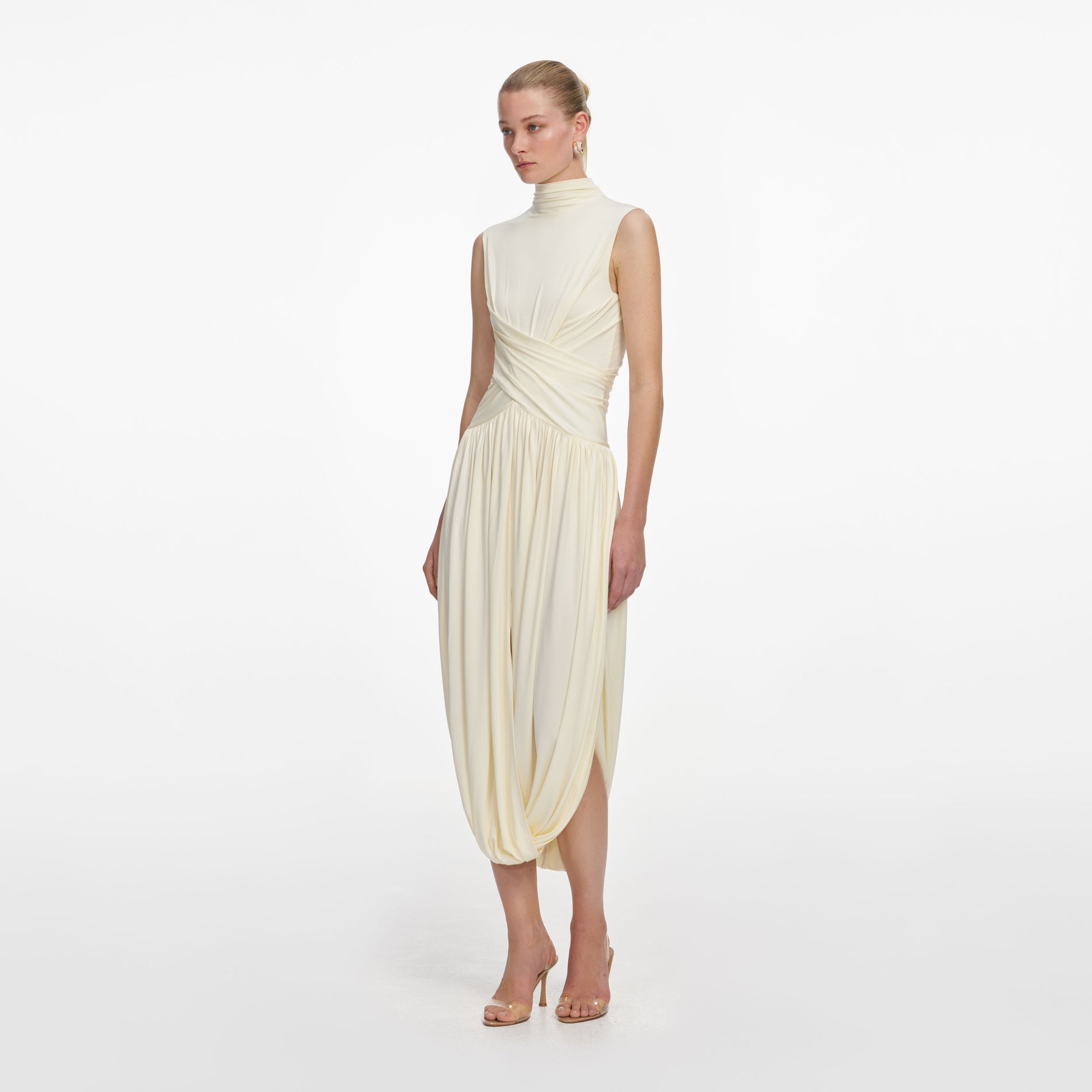 Side view of a woman wearing the Yellow Jersey Wrap Midi Dress