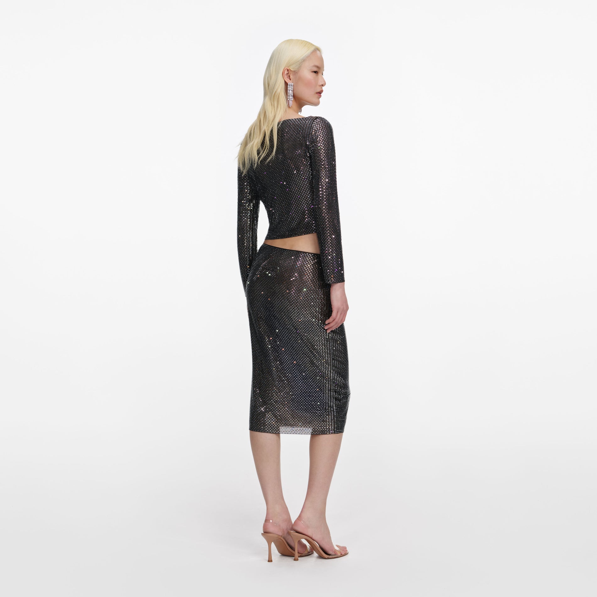 Back view of a woman wearing the Gunmetal Rhinestone Midi Skirt