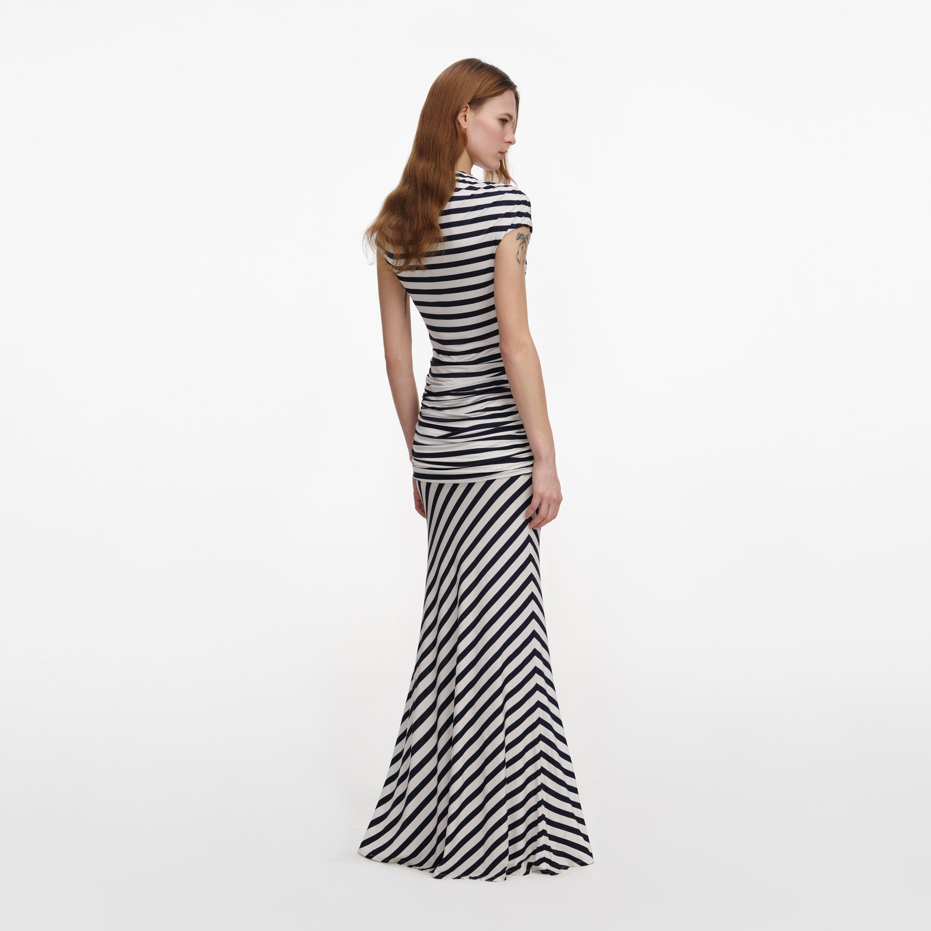 Back view of a woman wearing the Navy Stripe Jersey Maxi Dress