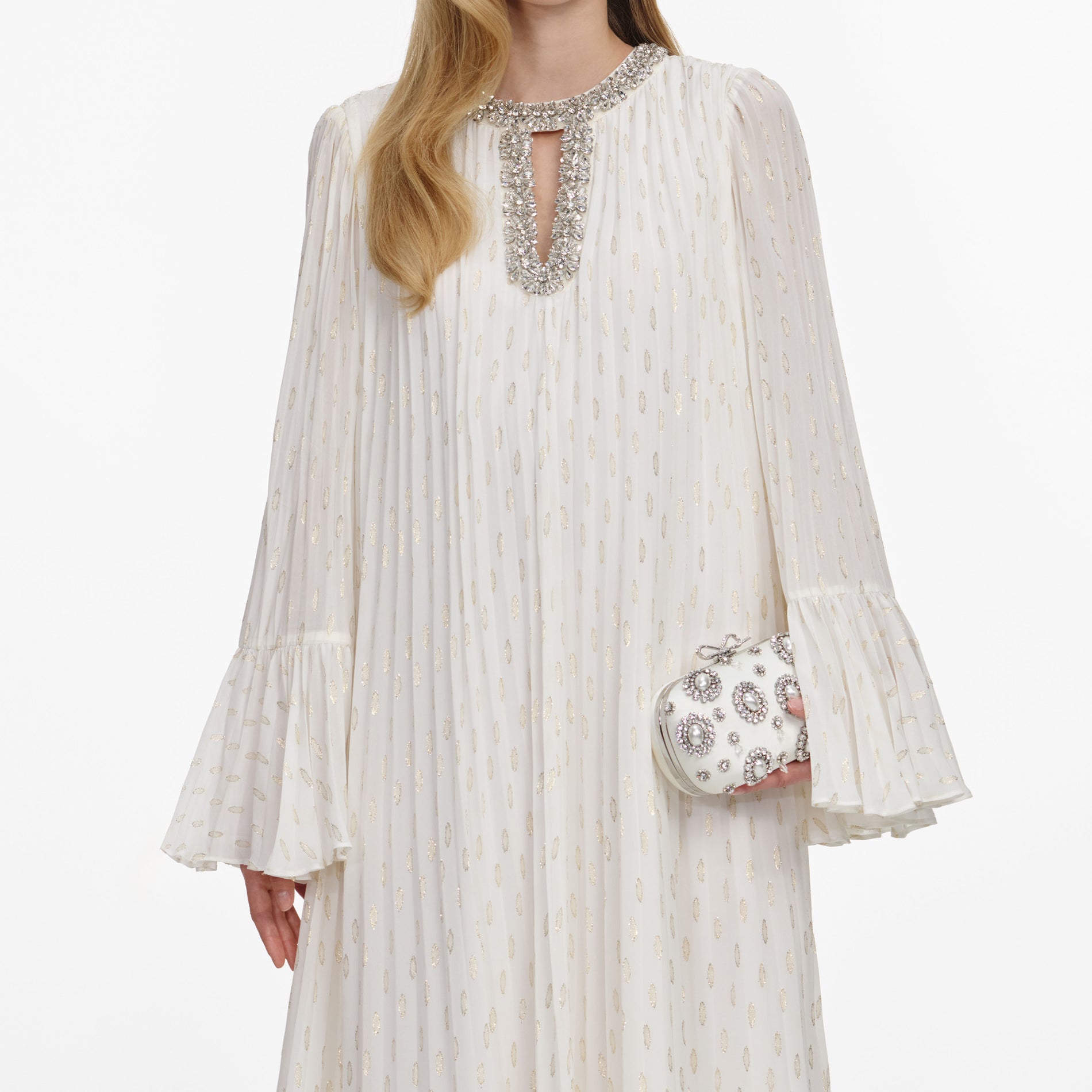 A close up of a woman wearing the Cream And Gold Chiffon Maxi Dress