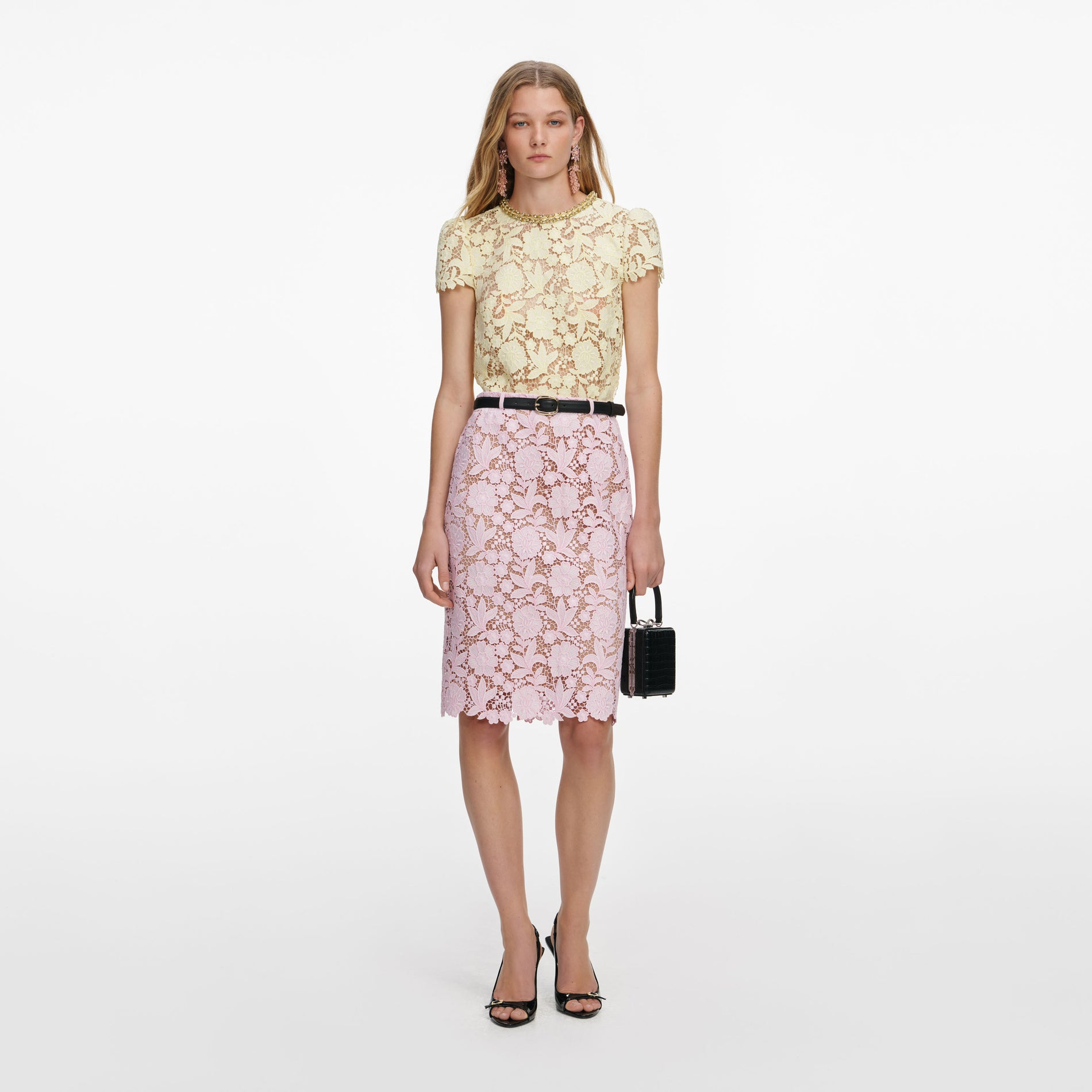 Front view of a woman wearing the Pink Lace Midi Skirt