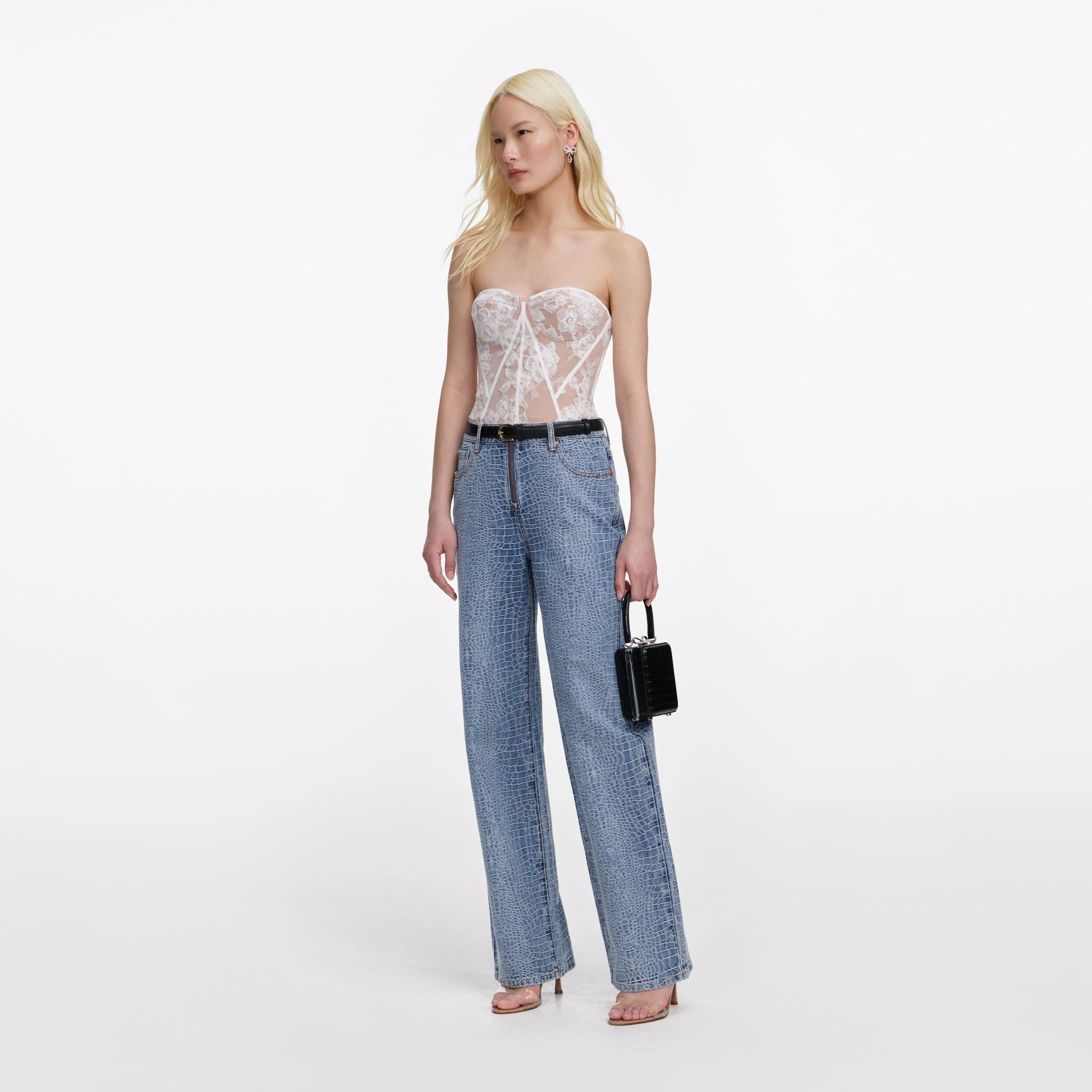 Side view of a woman wearing the White Sequin Lace Bandeau Top