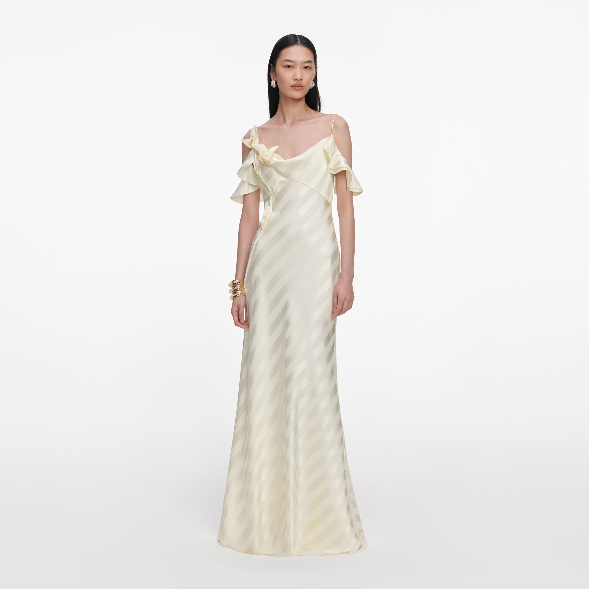 Front view of a woman wearing the Yellow Satin Striped Maxi Dress