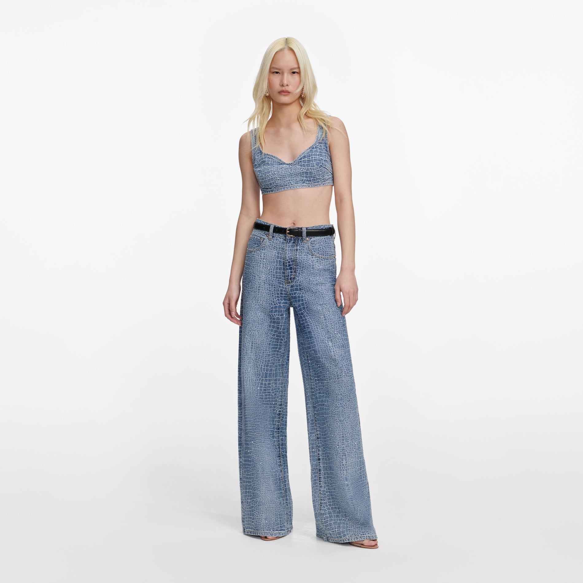 Front view of a woman wearing the Rhinestone Croc Effect Wide Leg Jeans