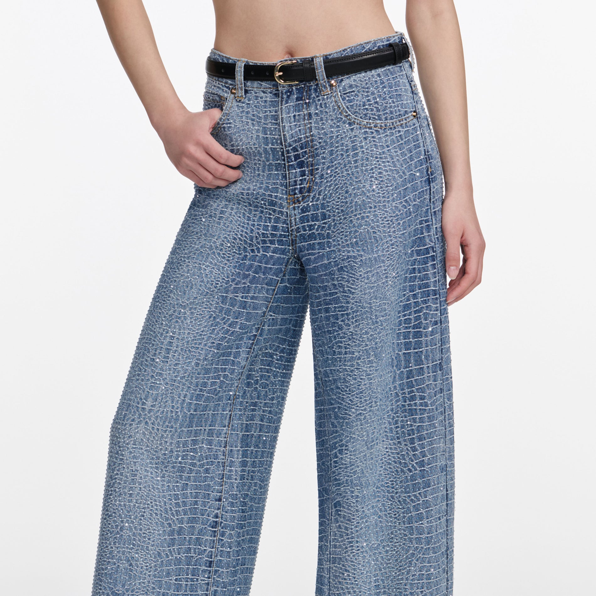 A close up of a woman wearing the Rhinestone Croc Effect Wide Leg Jeans