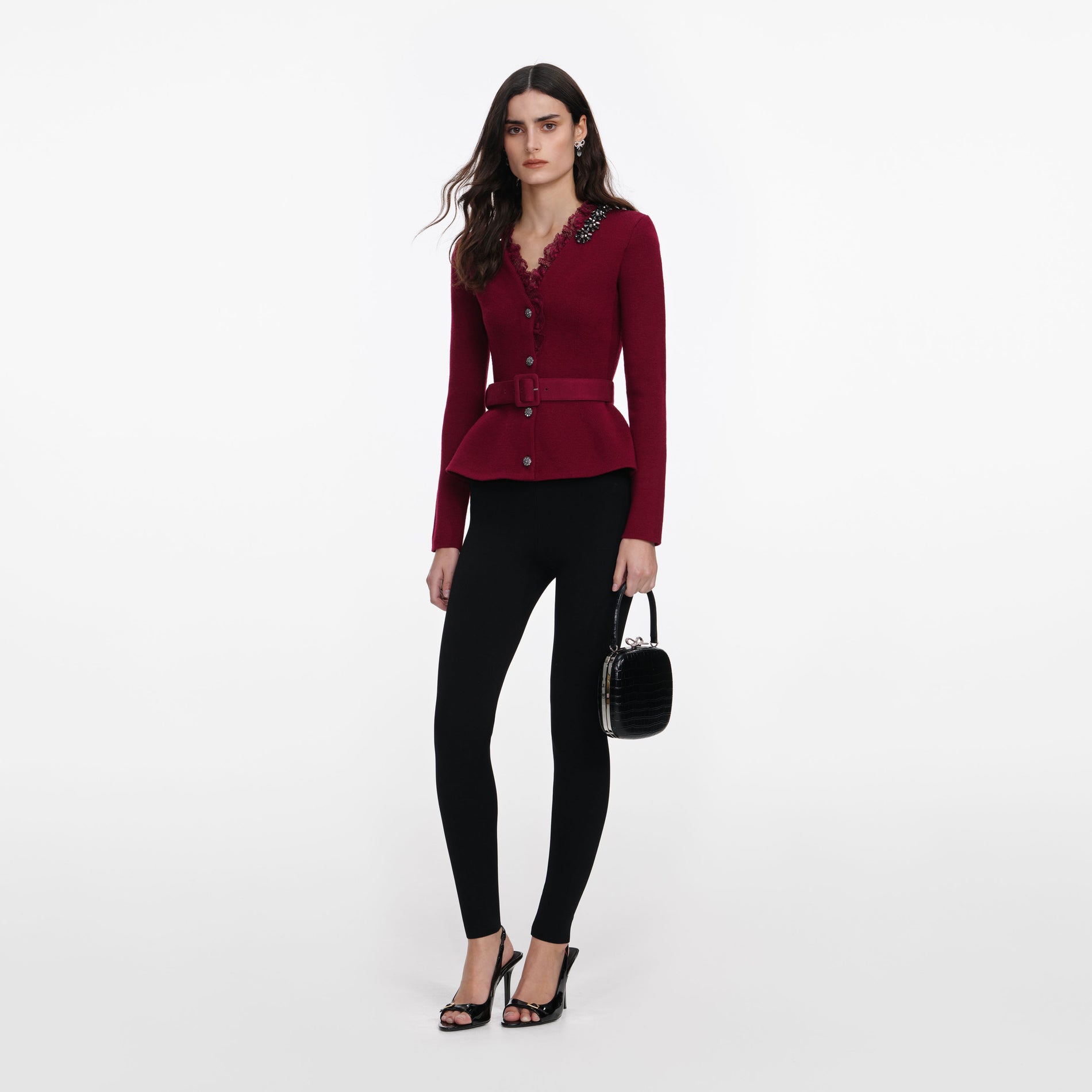 Side view of a woman wearing the Burgundy Crystal Trim Cardigan