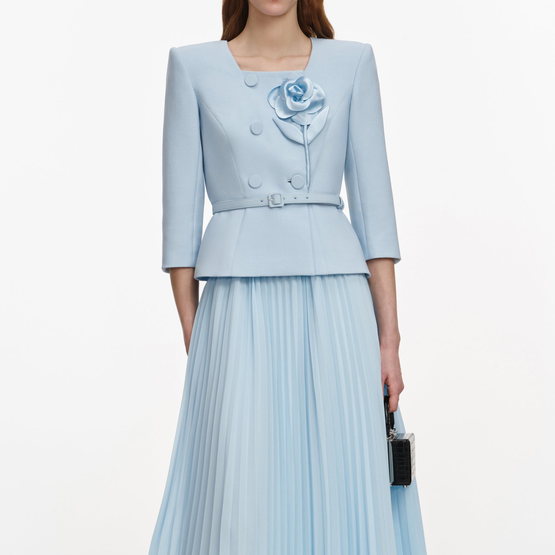 A close up of a woman wearing the Blue 3D Flower Chiffon Midi Dress