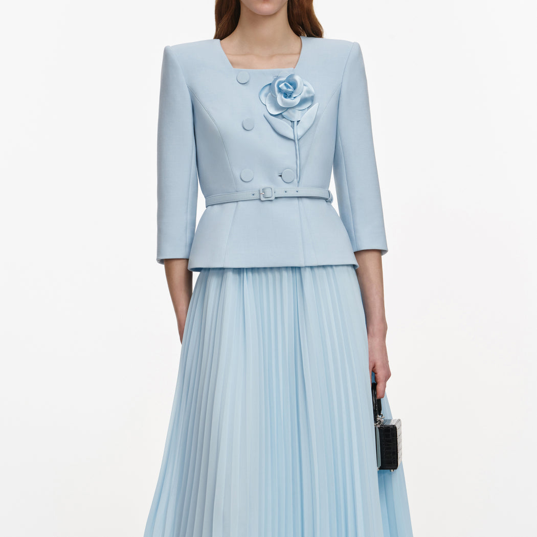 A close up of a woman wearing the Blue 3D Flower Chiffon Midi Dress