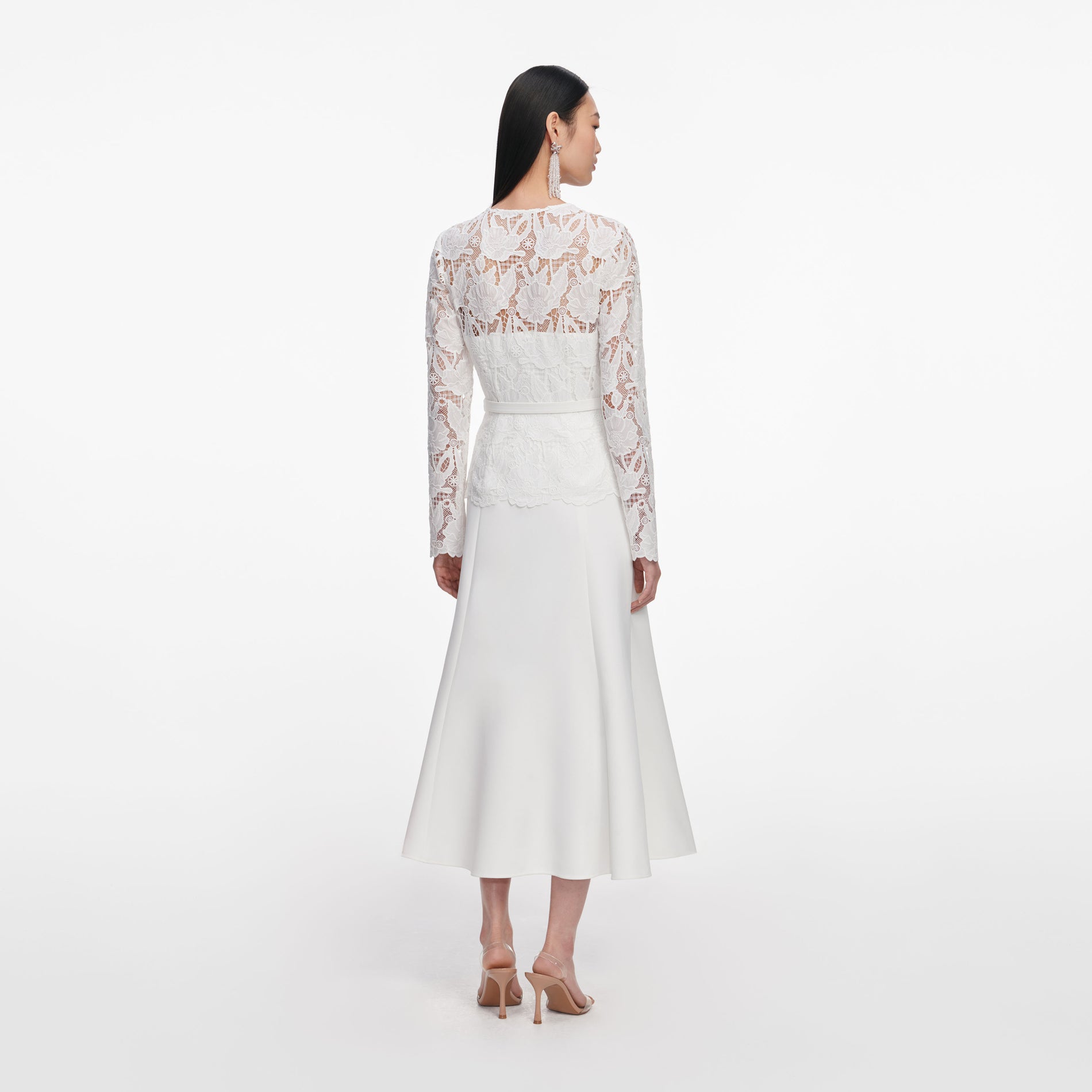 Back view of a woman wearing the White Lace Crepe Midi Dress