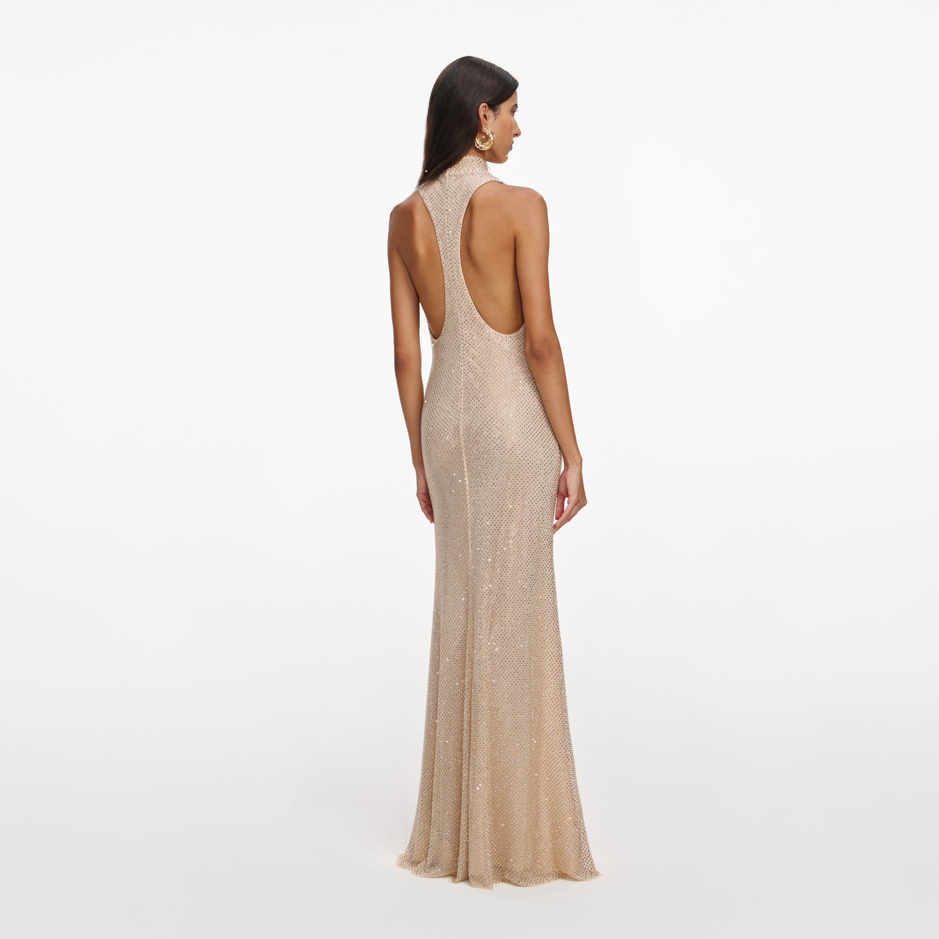 Back view of a woman wearing the Champagne Rhinestone Racer Back Maxi Dress