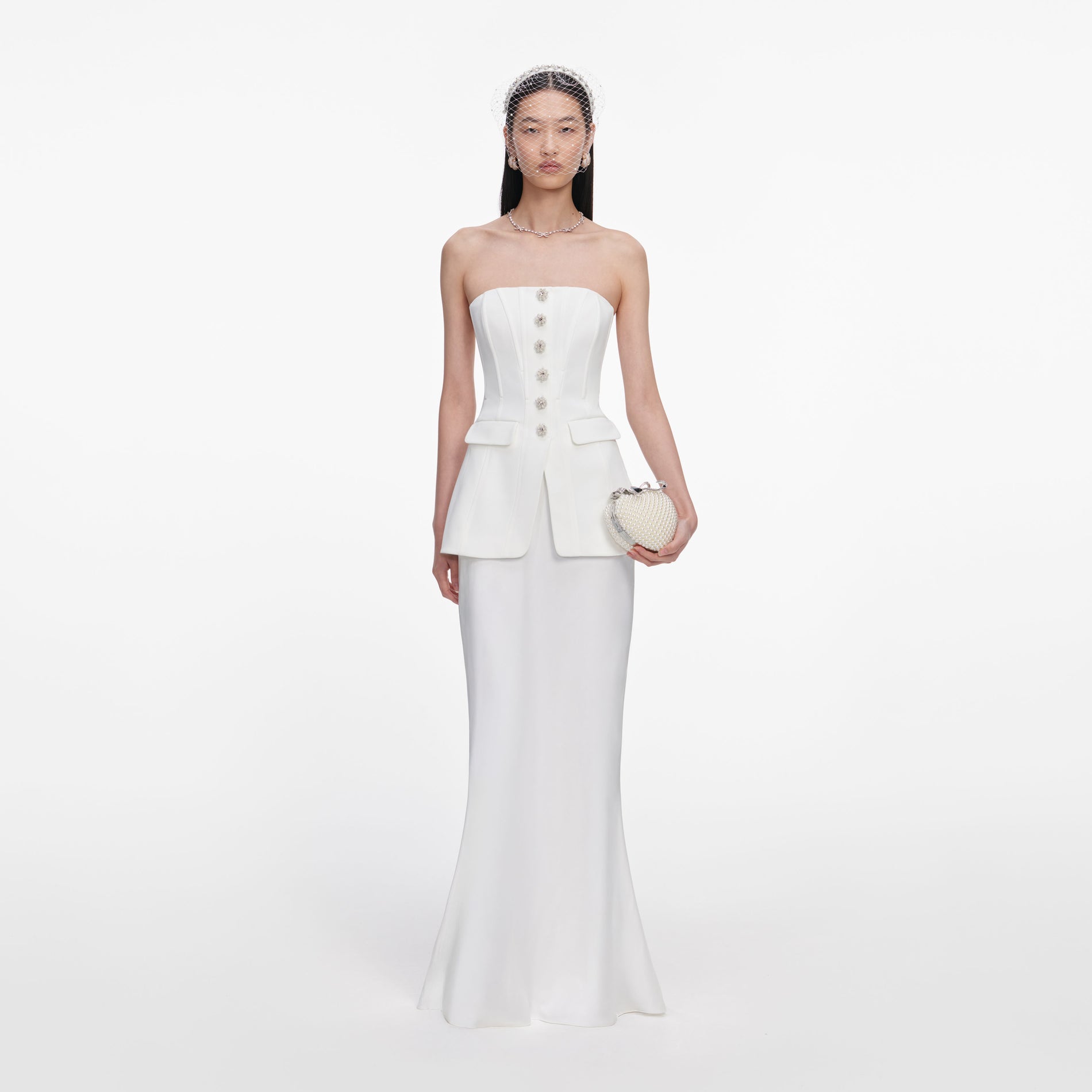 Front view of a woman wearing the White Bandeau Maxi Dress