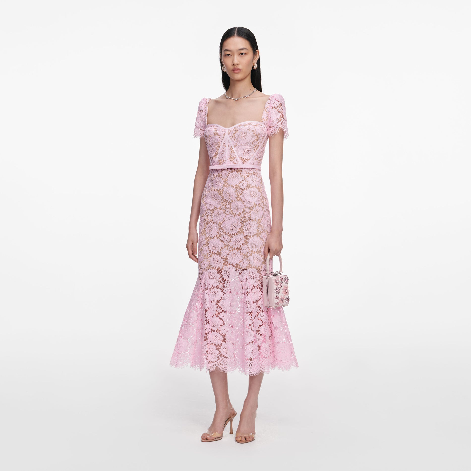 Side view of a woman wearing the Pink Fine Lace Midi Dress