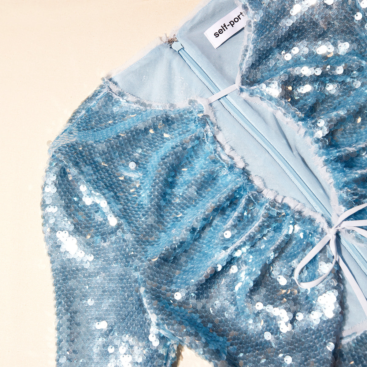 A close up of the fabric for the Blue Sequin Maxi Dress
