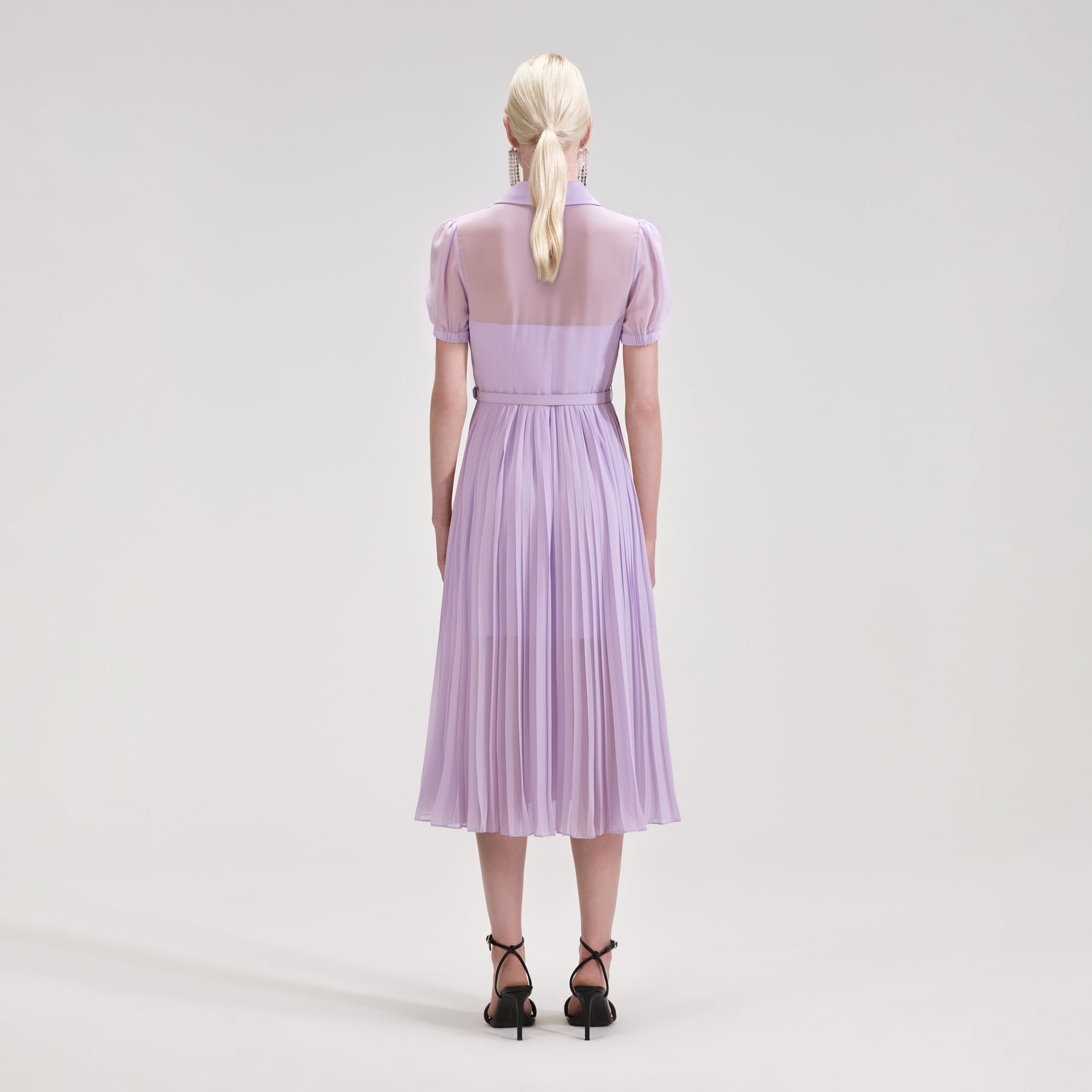 A woman wearing the Lilac Chiffon Pleated Collar Midi Dress