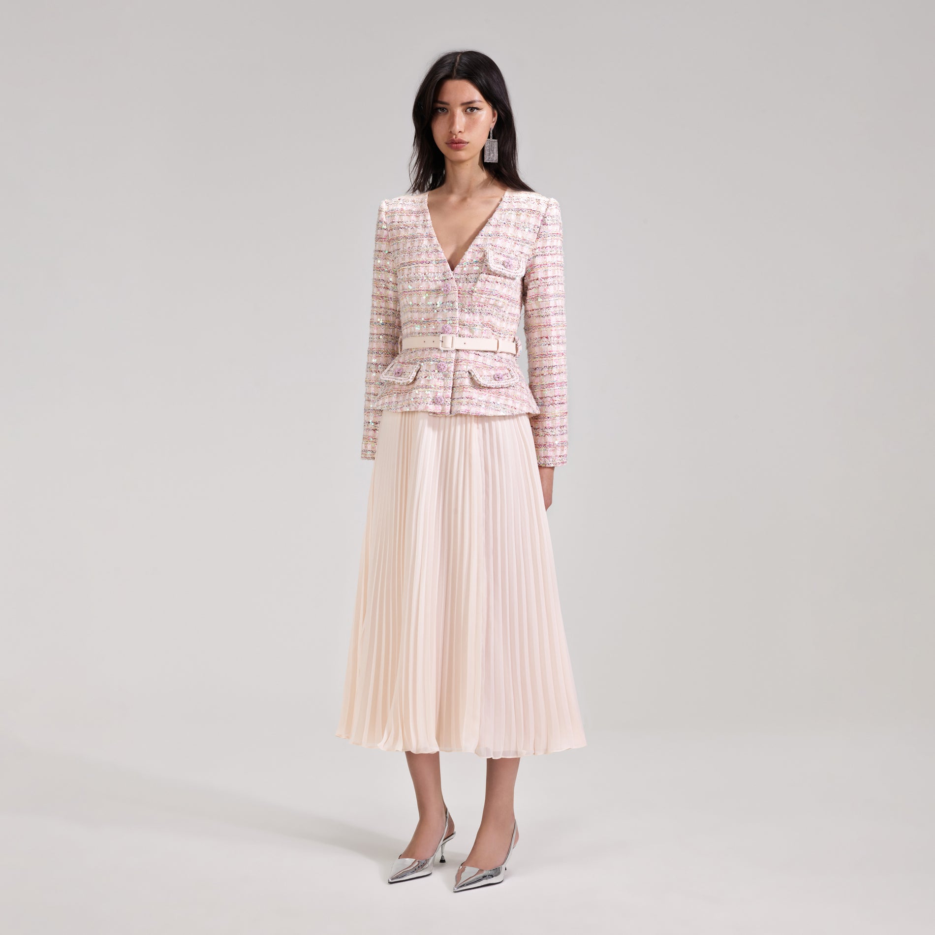 A woman wearing the Pink Sequin Boucle Midi Dress