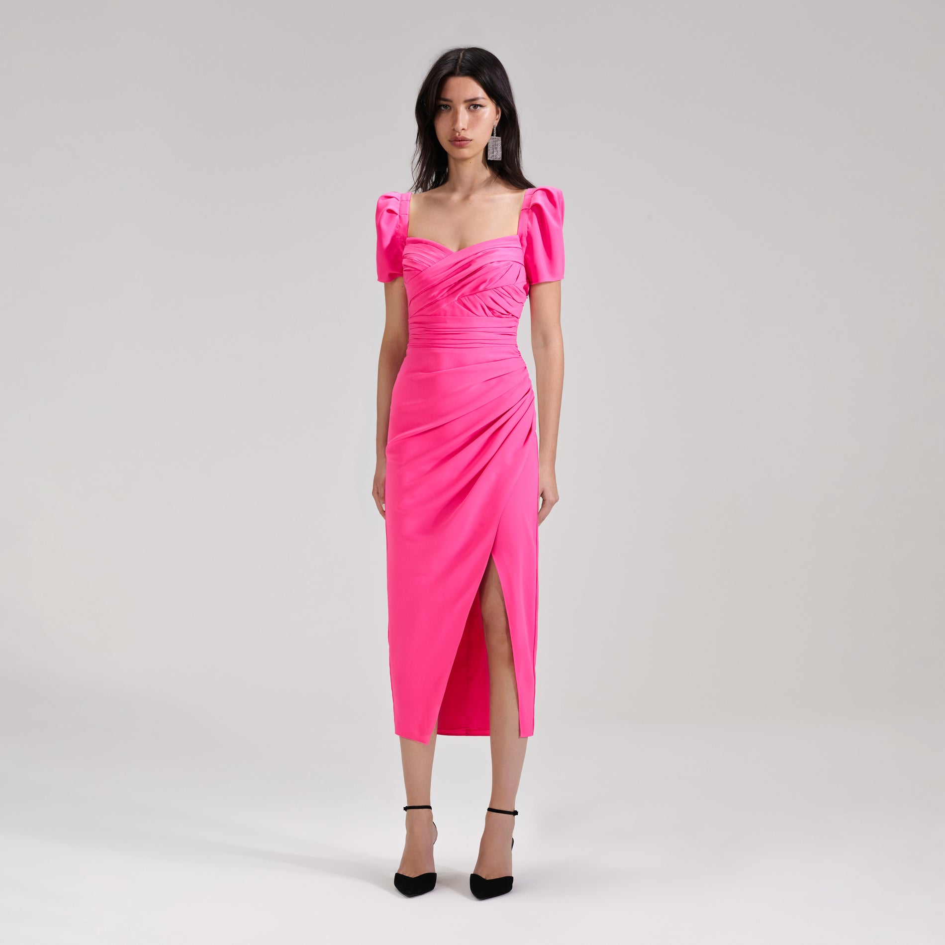 A woman wearing the Bright Pink Iris Midi Dress
