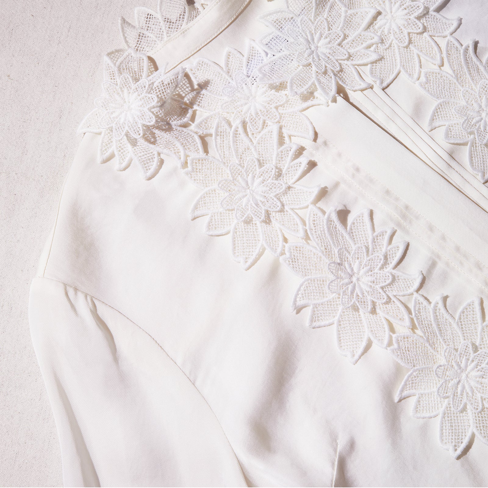 A close up of the fabric for the Cream Viscose Flower Top