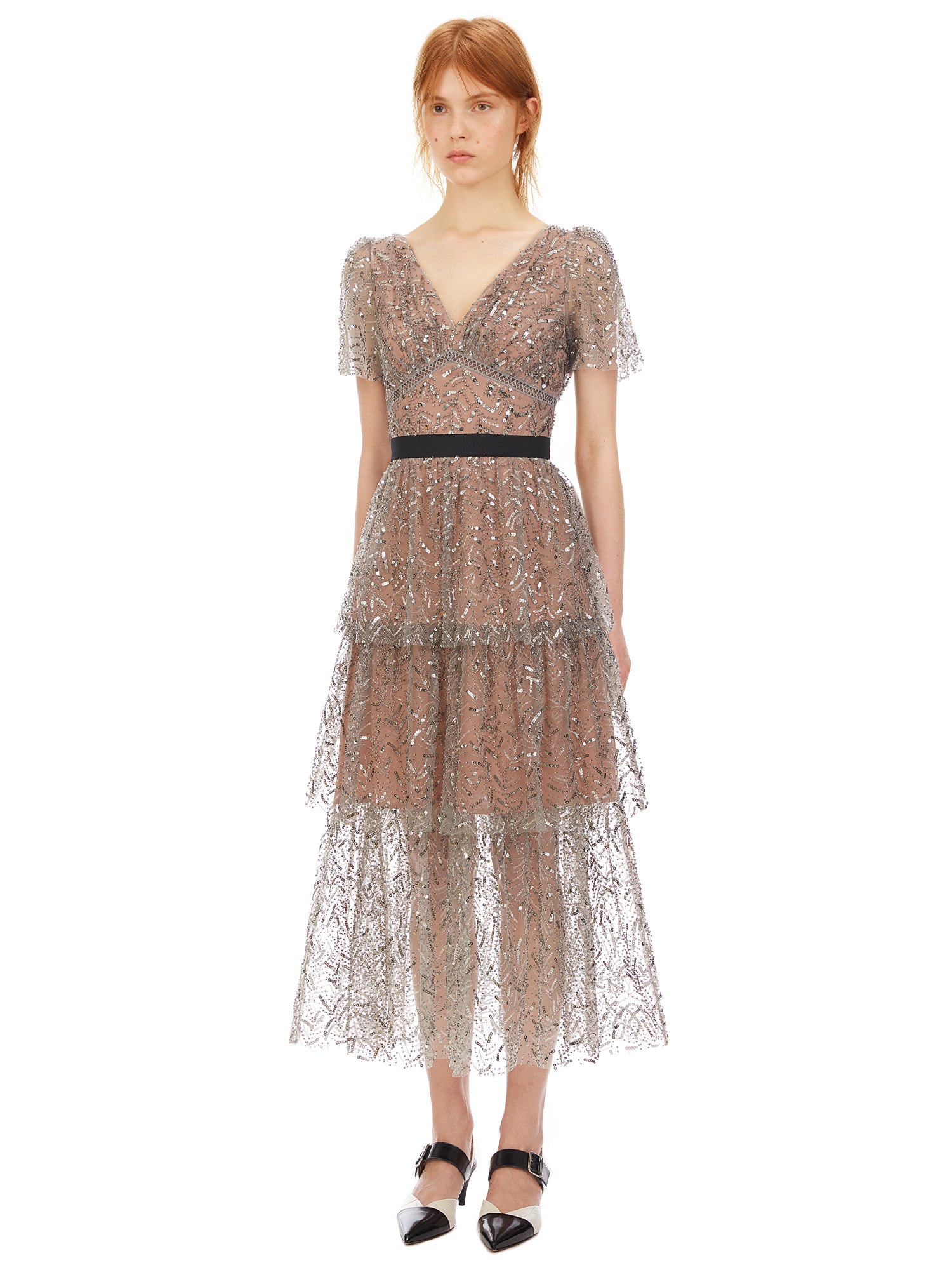 A woman wearing the Leaf Sequin Midi Dress