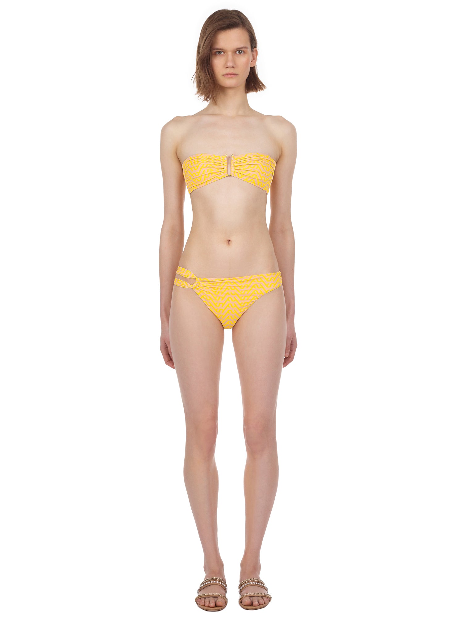 Front view of a woman wearing the Yellow Logo Printed Ruched Bikini Briefs
