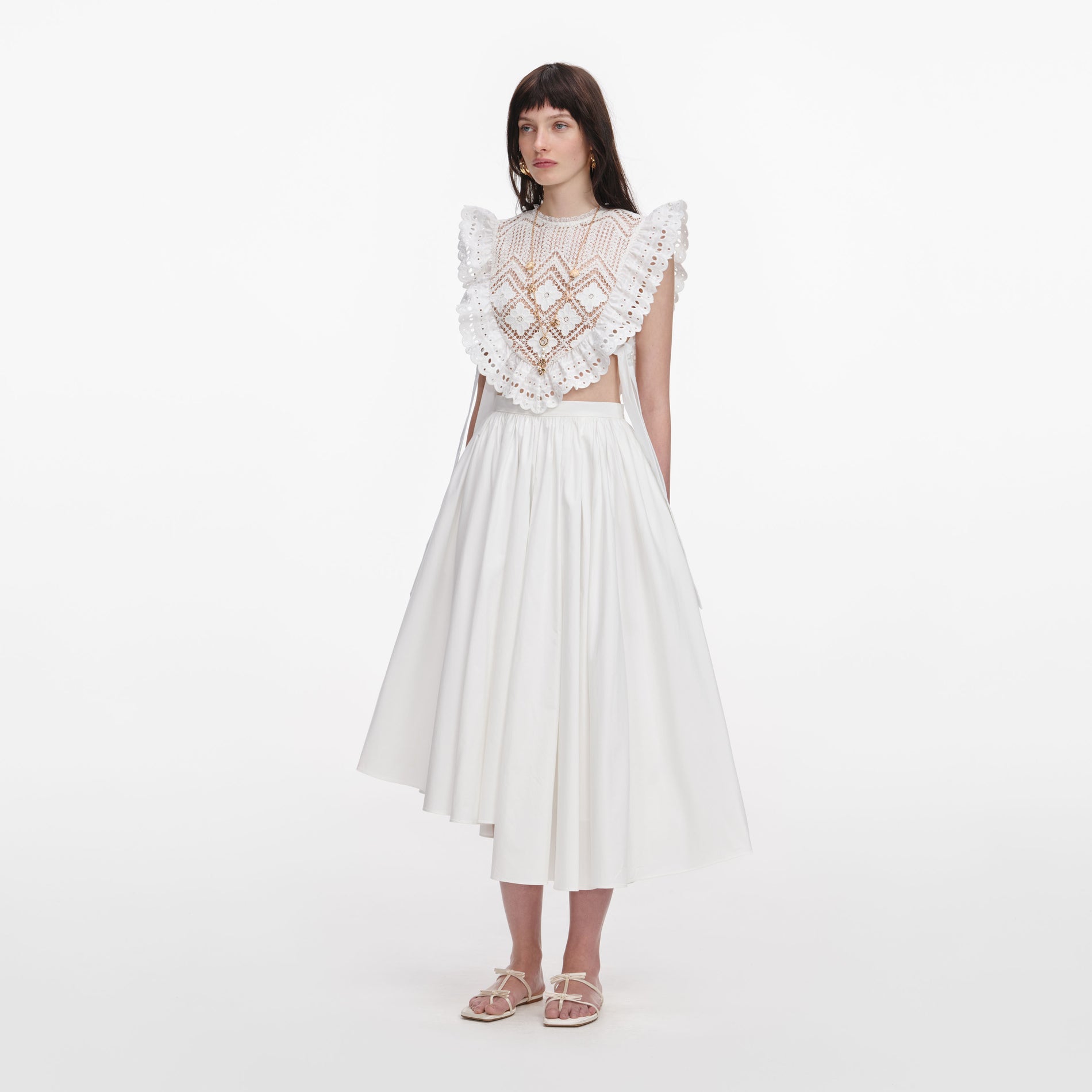 Side view of a woman wearing the White Crochet Lace Crop Top