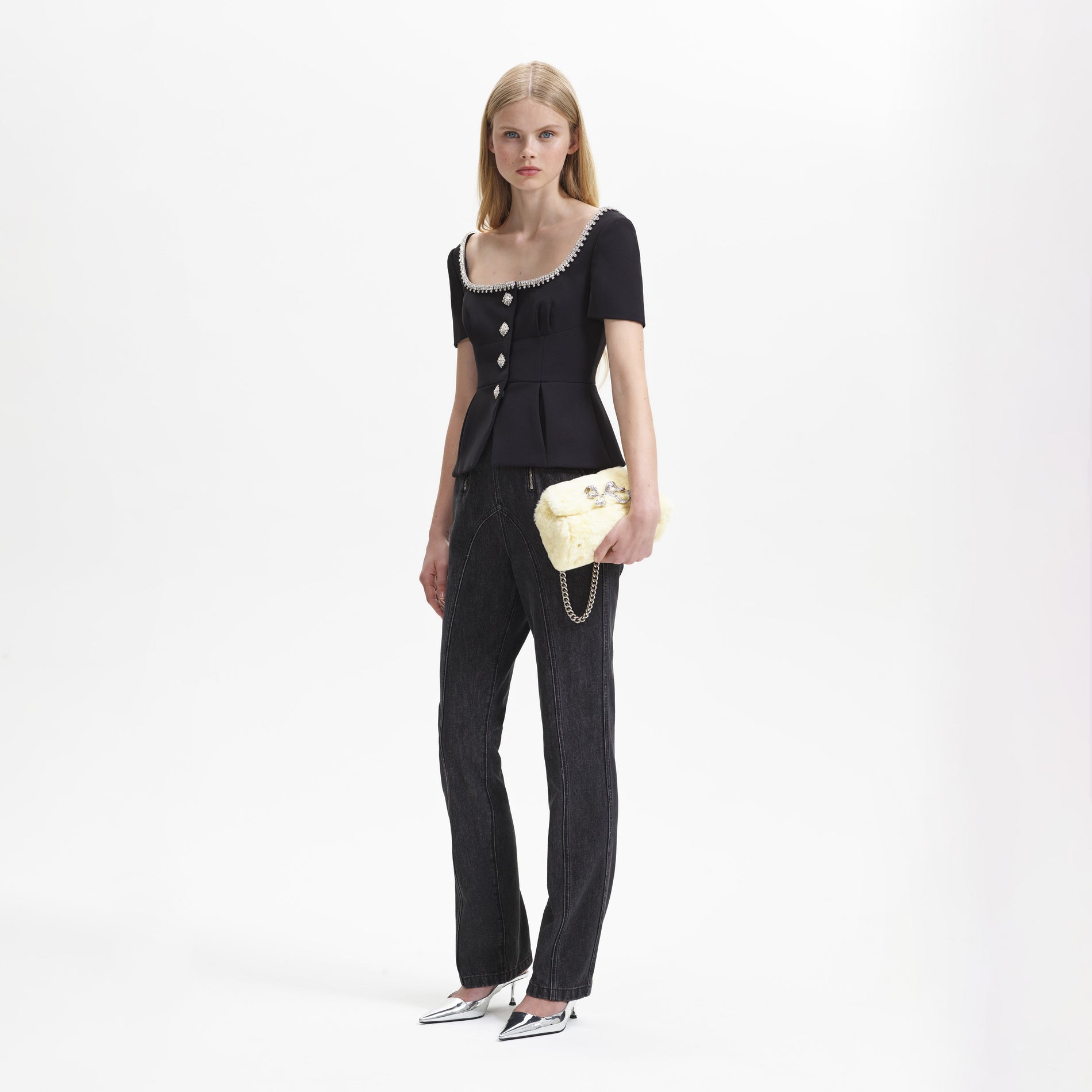 A woman wearing the Black Bonded Crepe Top