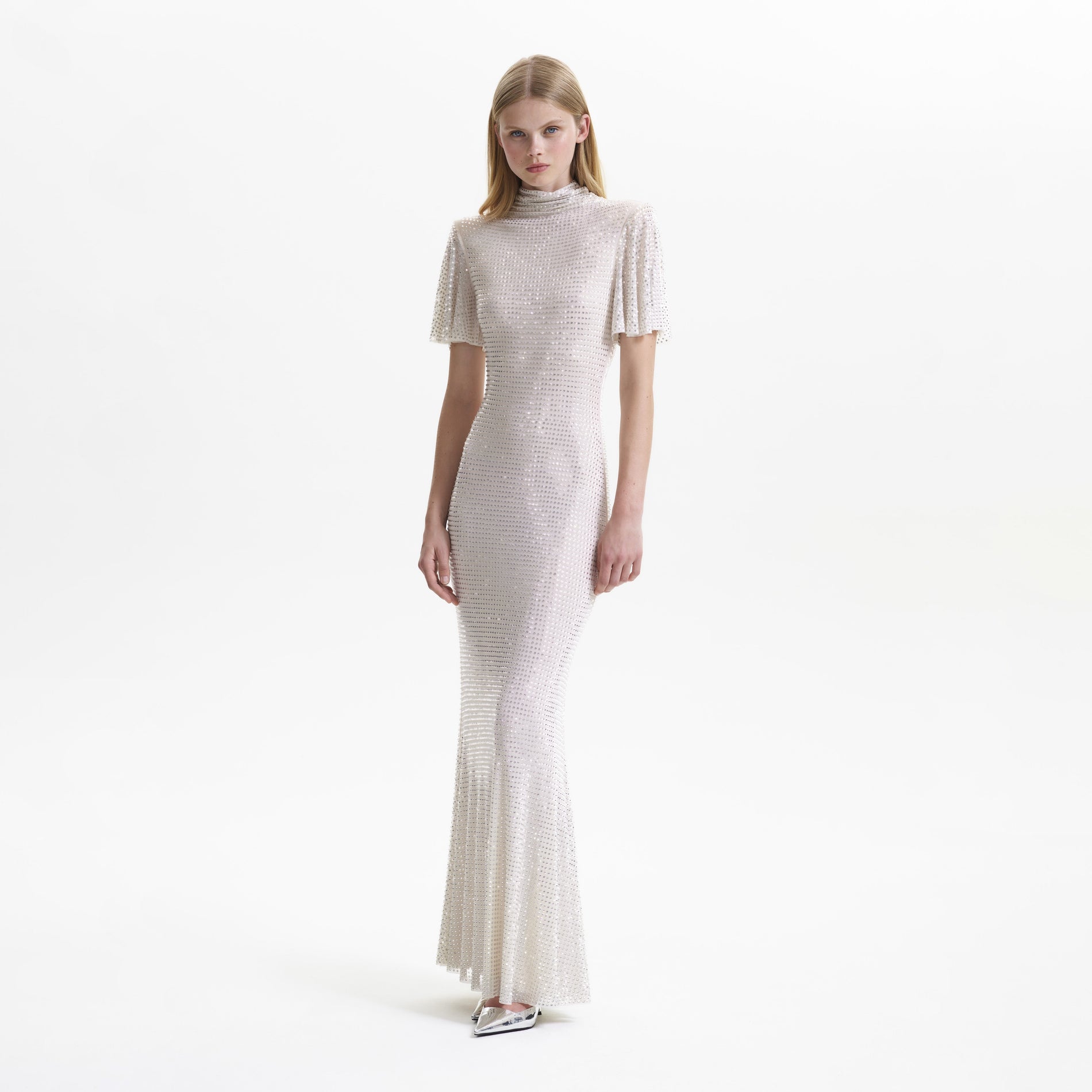 A woman wearing the Cream Rhinestone Mesh Maxi Dress
