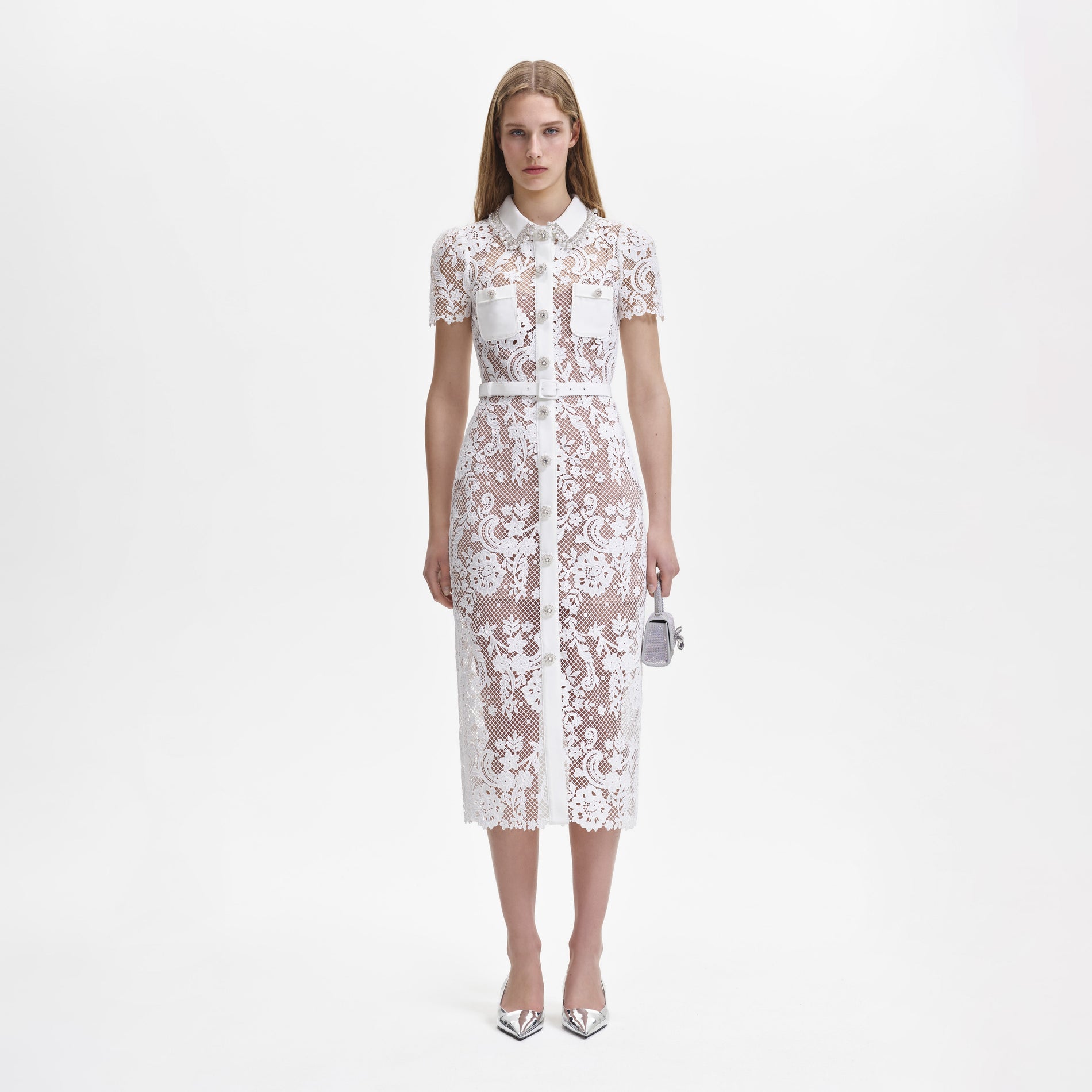 A woman wearing the White Lace Button Front Midi Dress